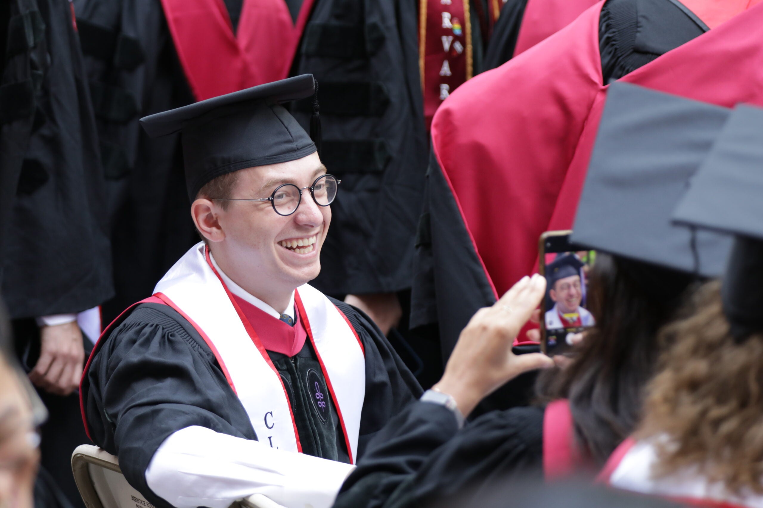 A graduating student having his photo taken