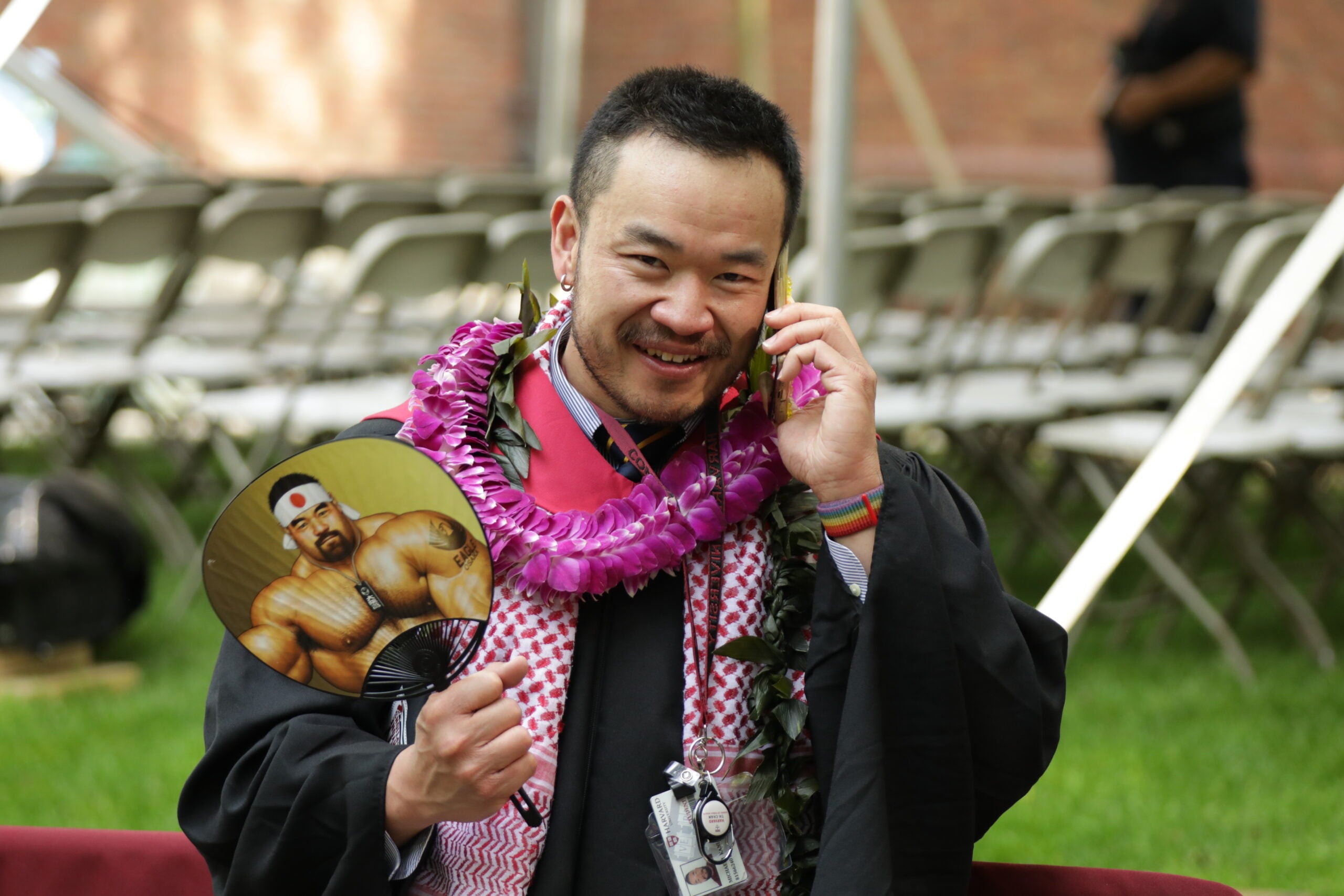 A graduating student talking on the phone
