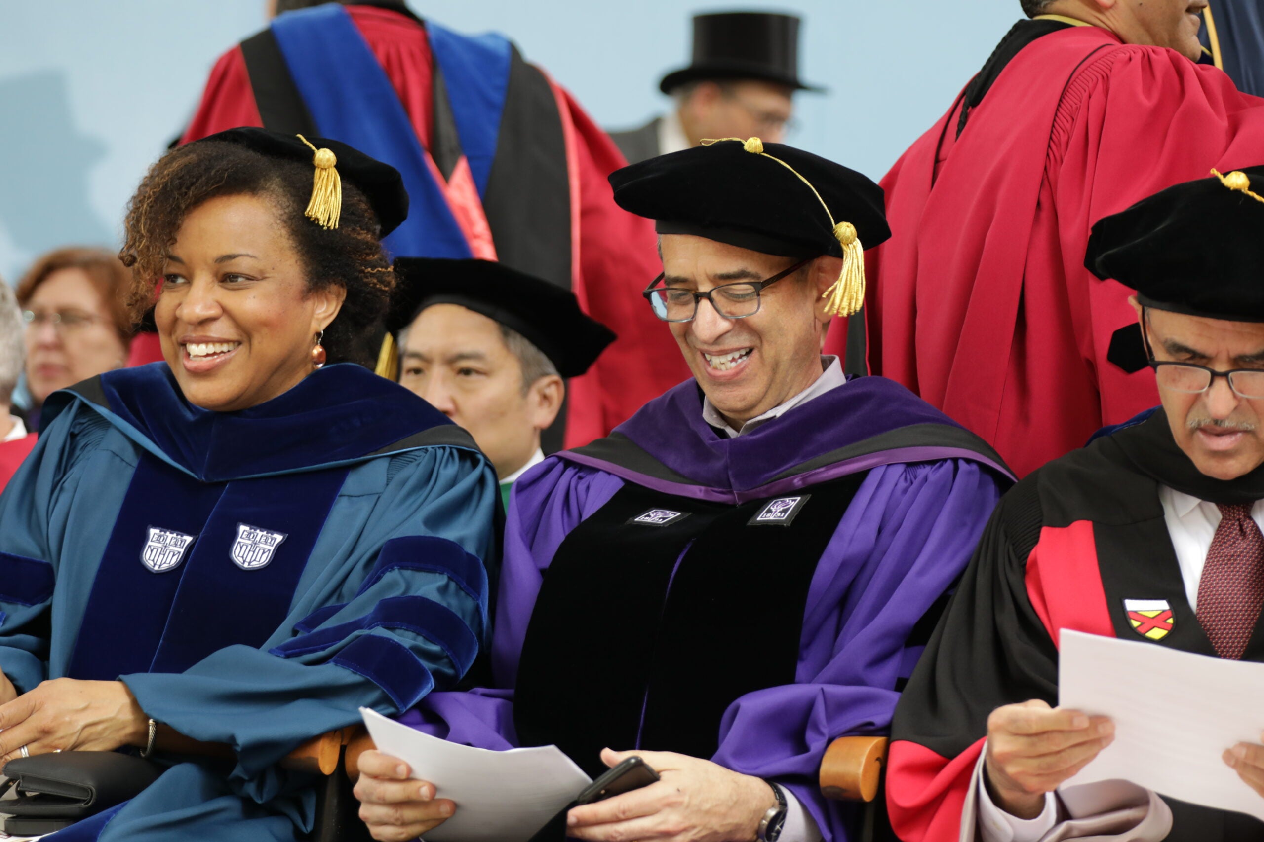 Faculty in regalia on stage