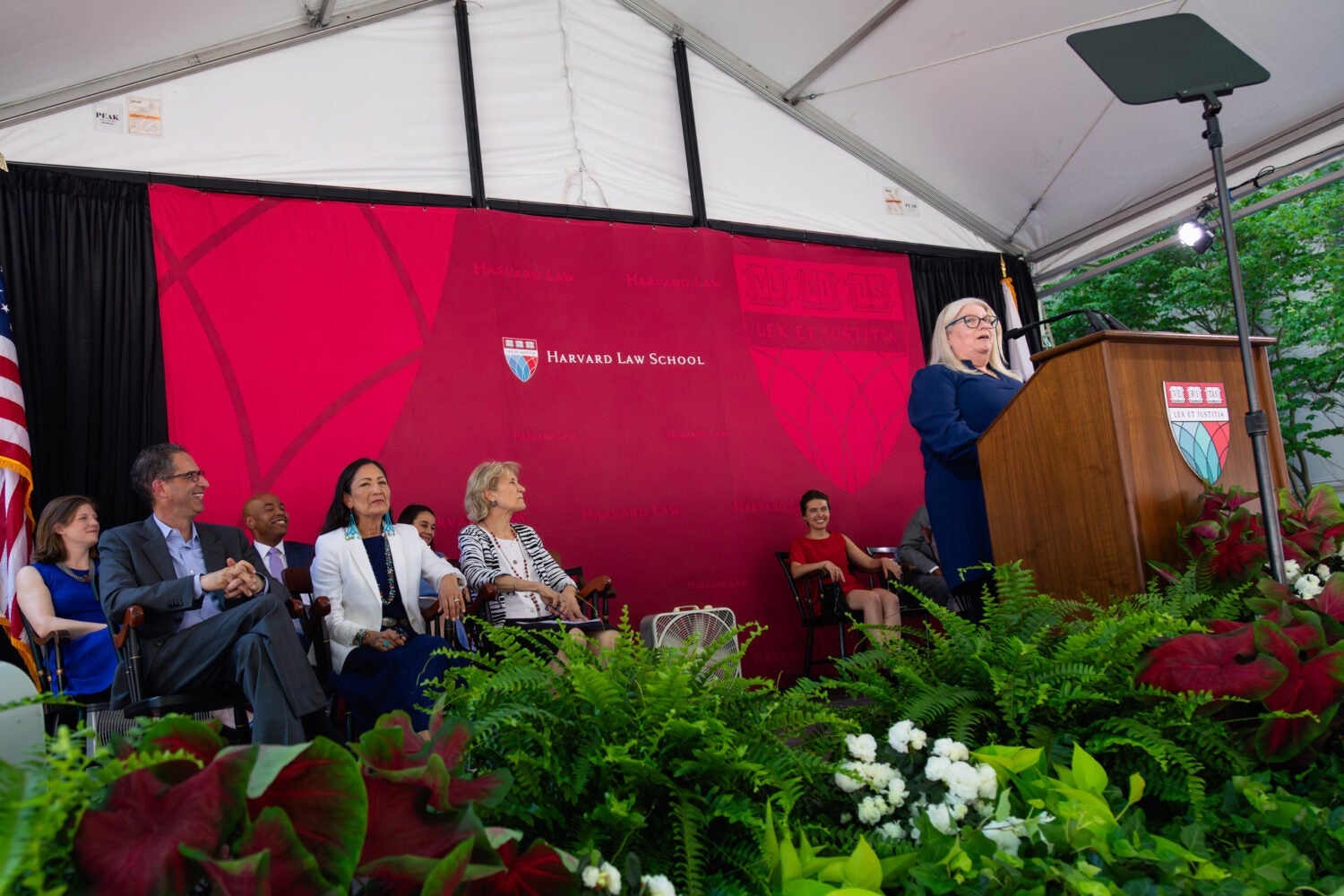 A woman speaking at a podium