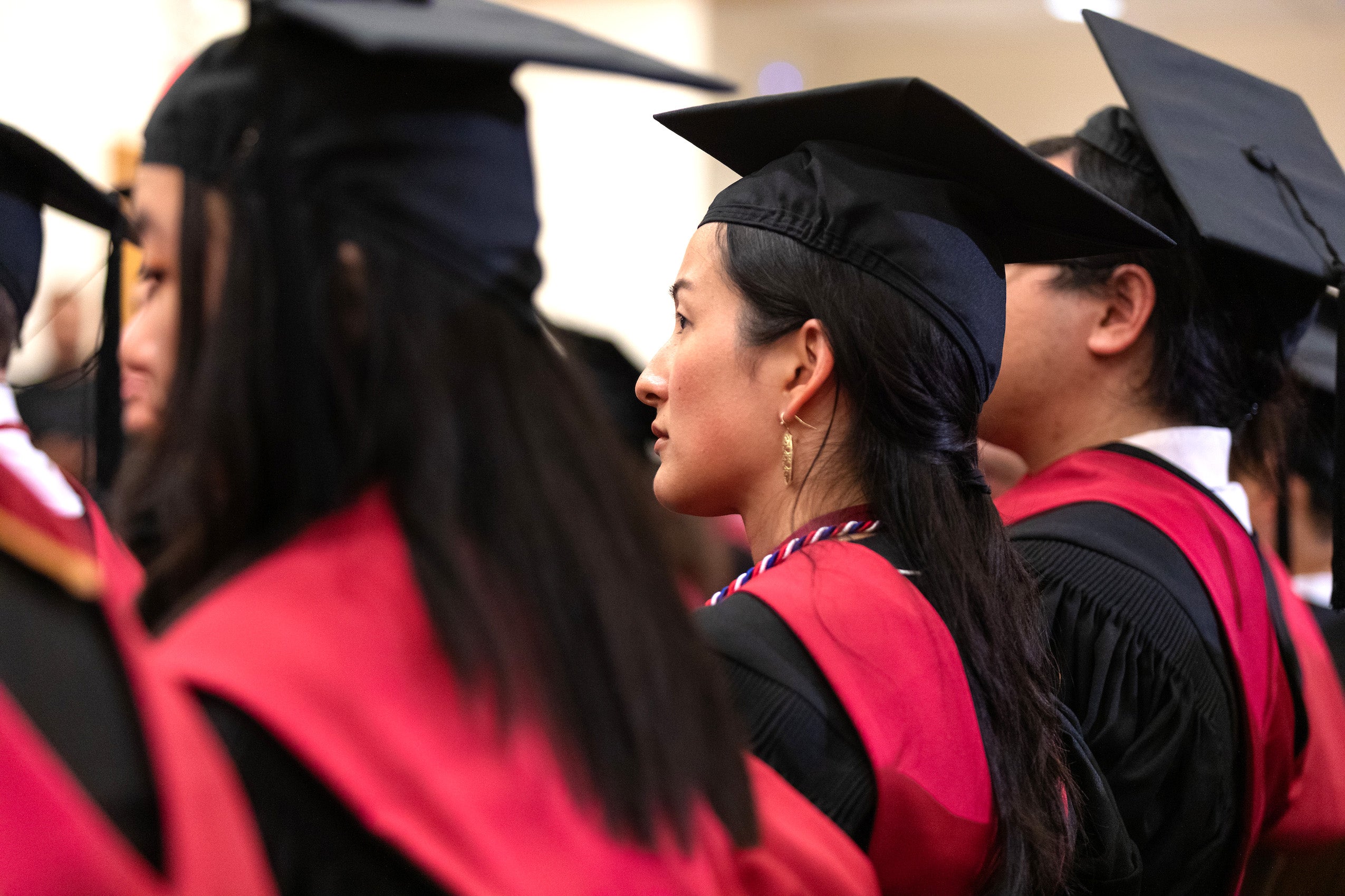 A row of people in cap and gown