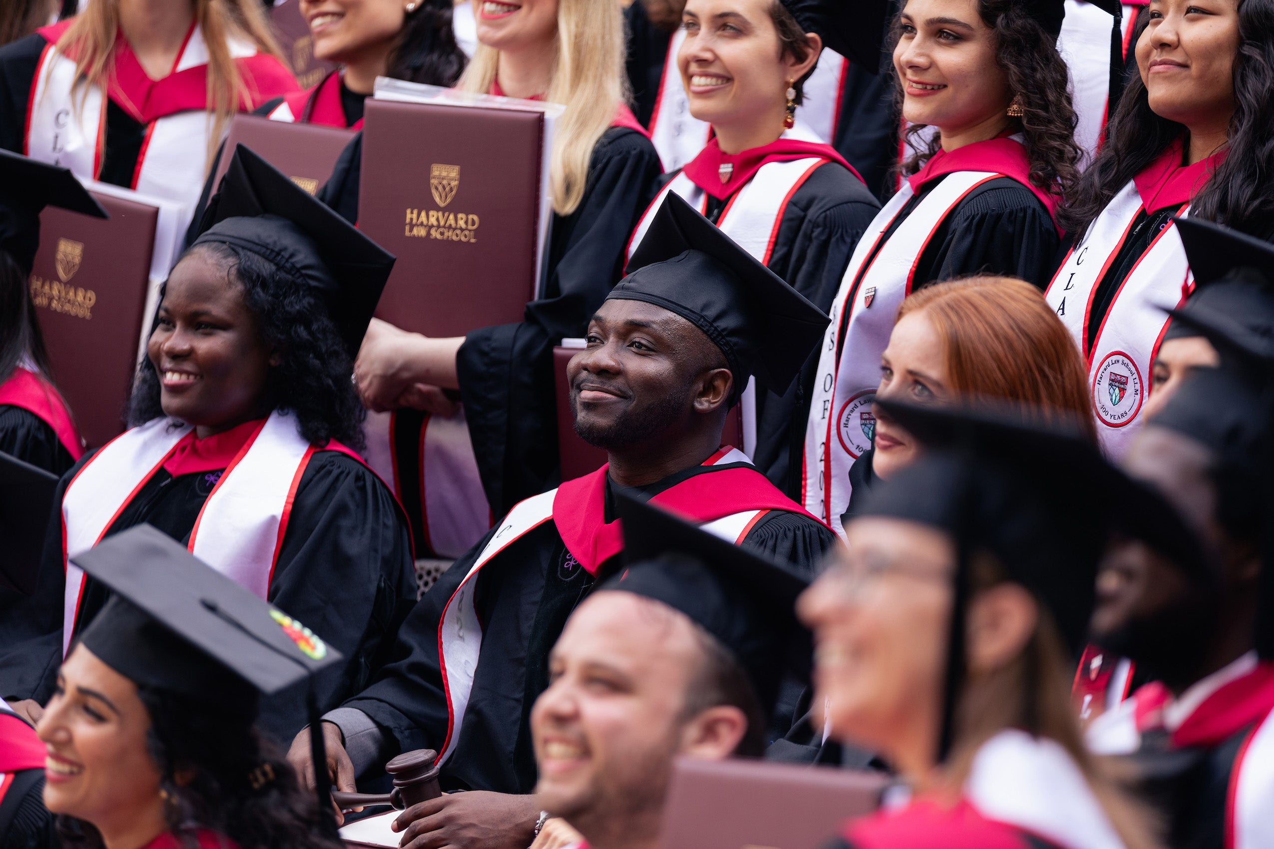 A close up of a rows of students posing for a group photo