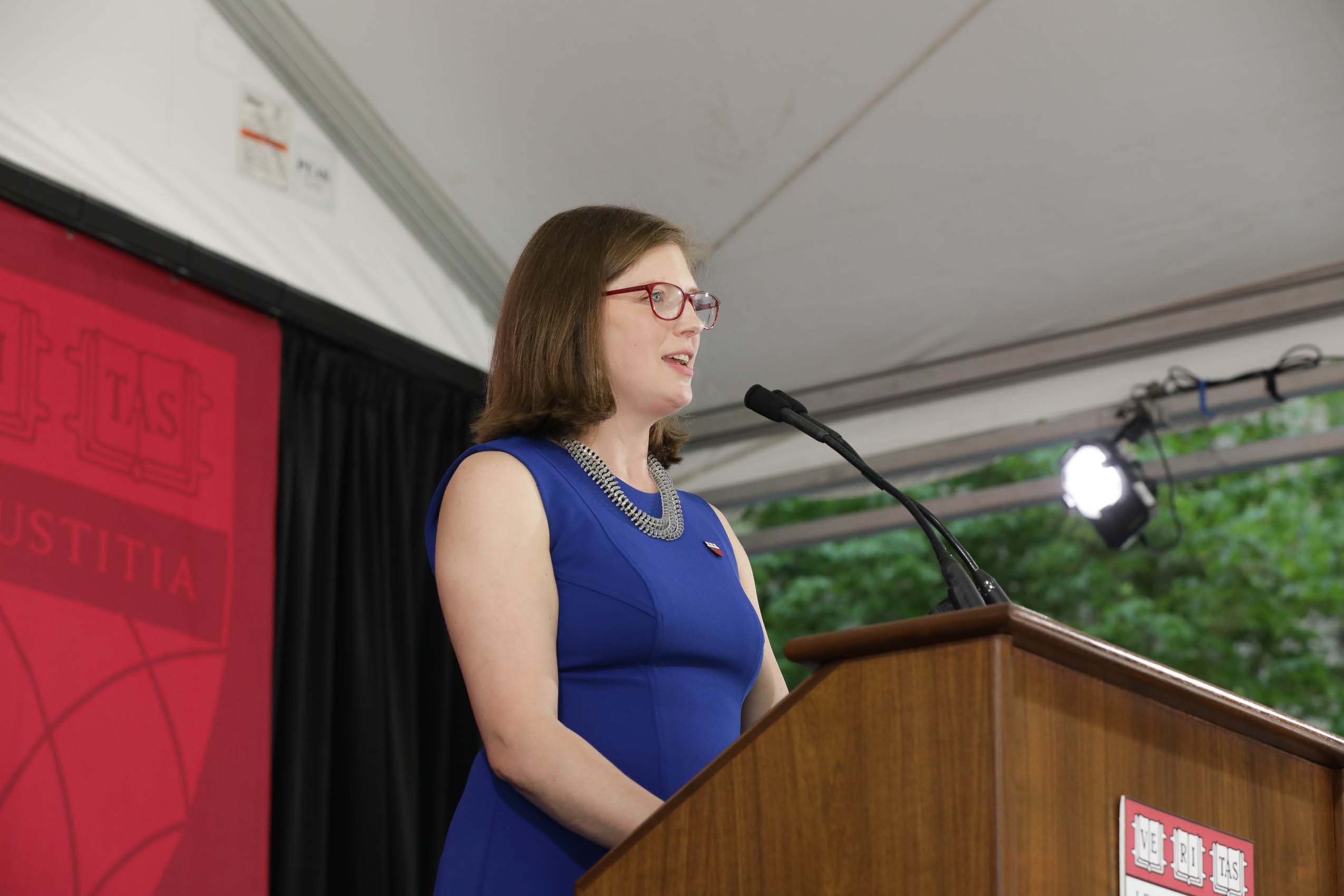 Lindsay Breedlove standing at a podium