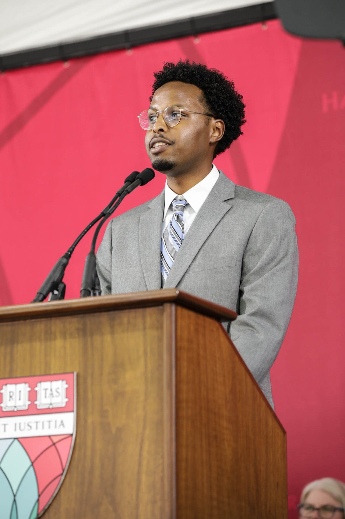 someone standing behind a podium on stage