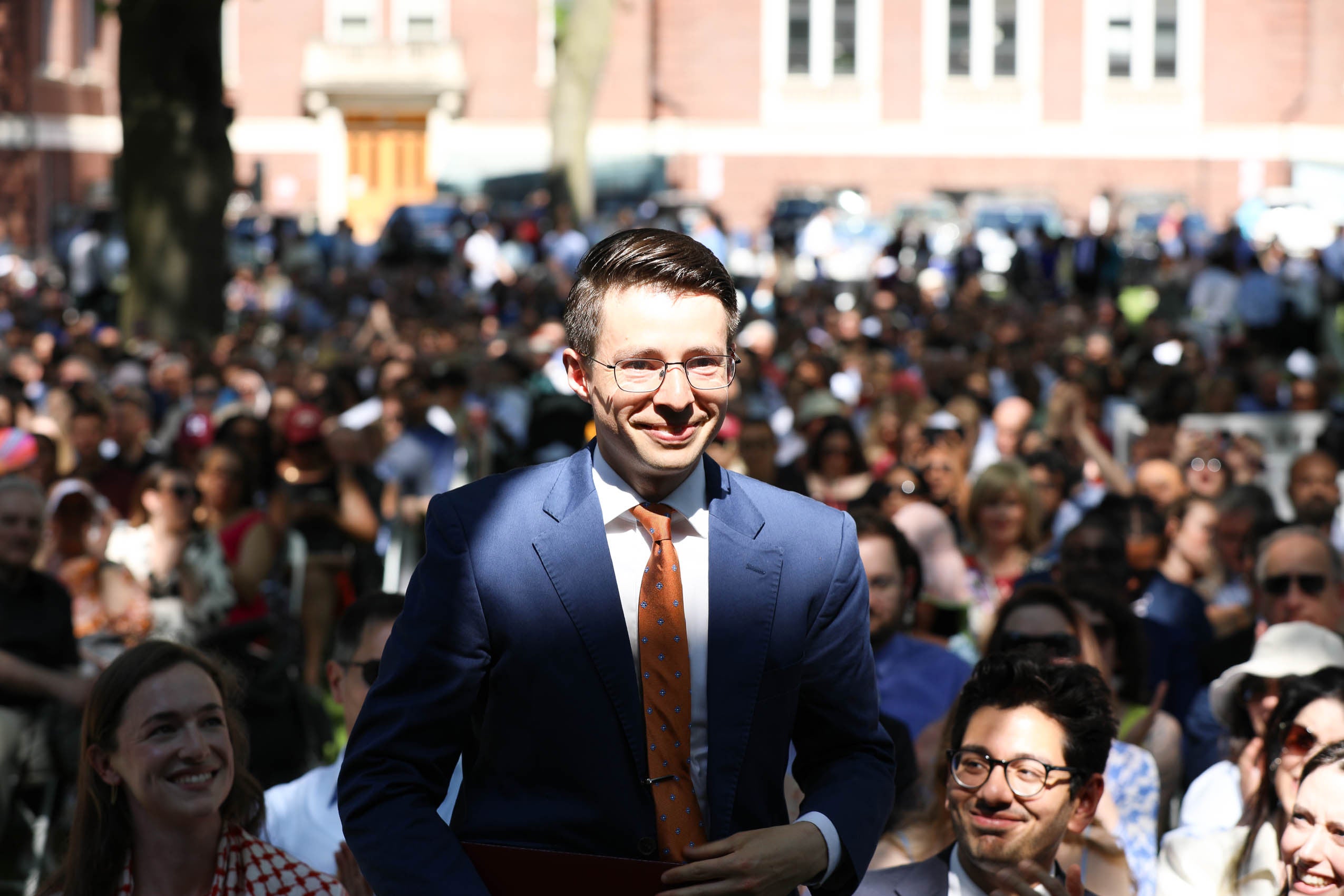 A man standing in the crowd
