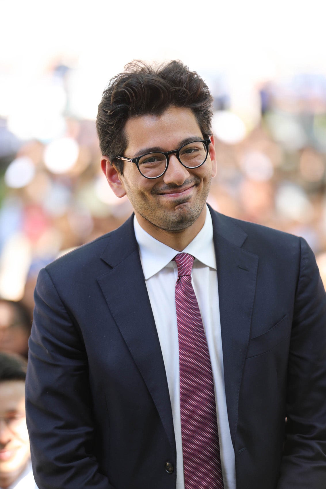 A man standing and smiling