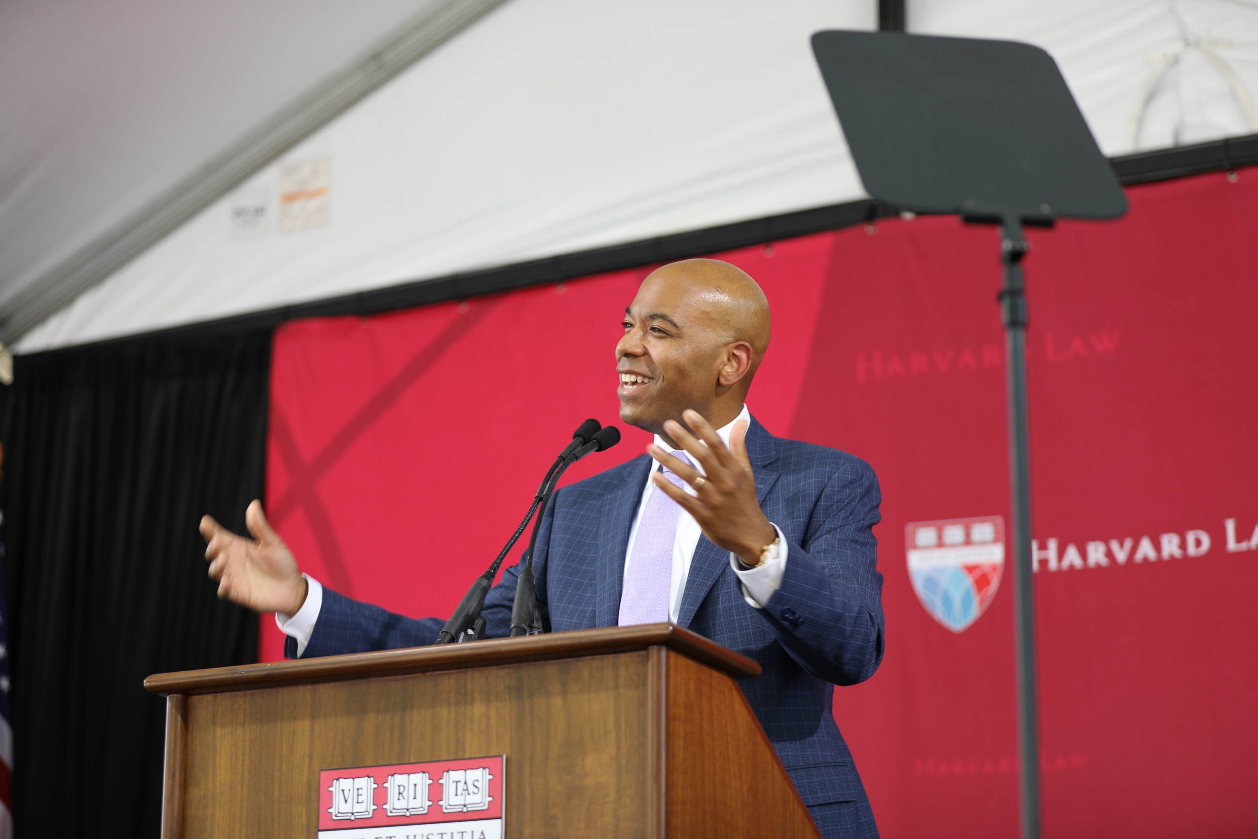 A man standing at a podium speaking