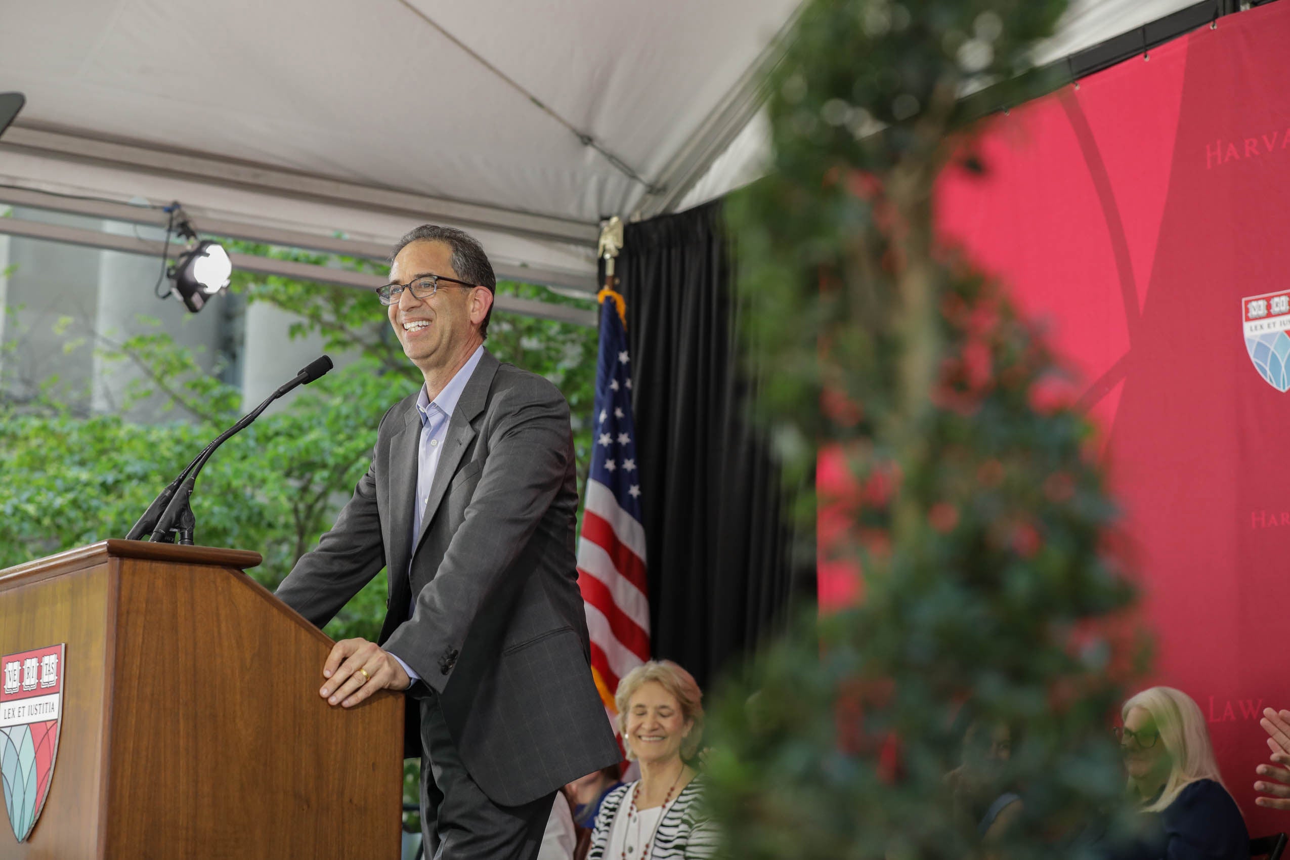 John Goldberg standing at podium on stage
