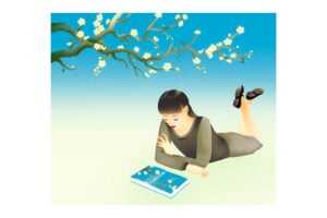 An illustration of A blossoming tree sits above a young woman who is looking at a book reflecting the tree