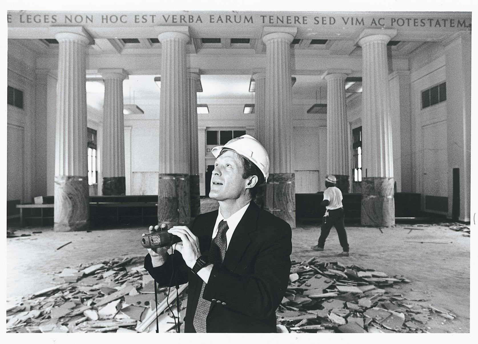 Man in hardhat holding binoculars