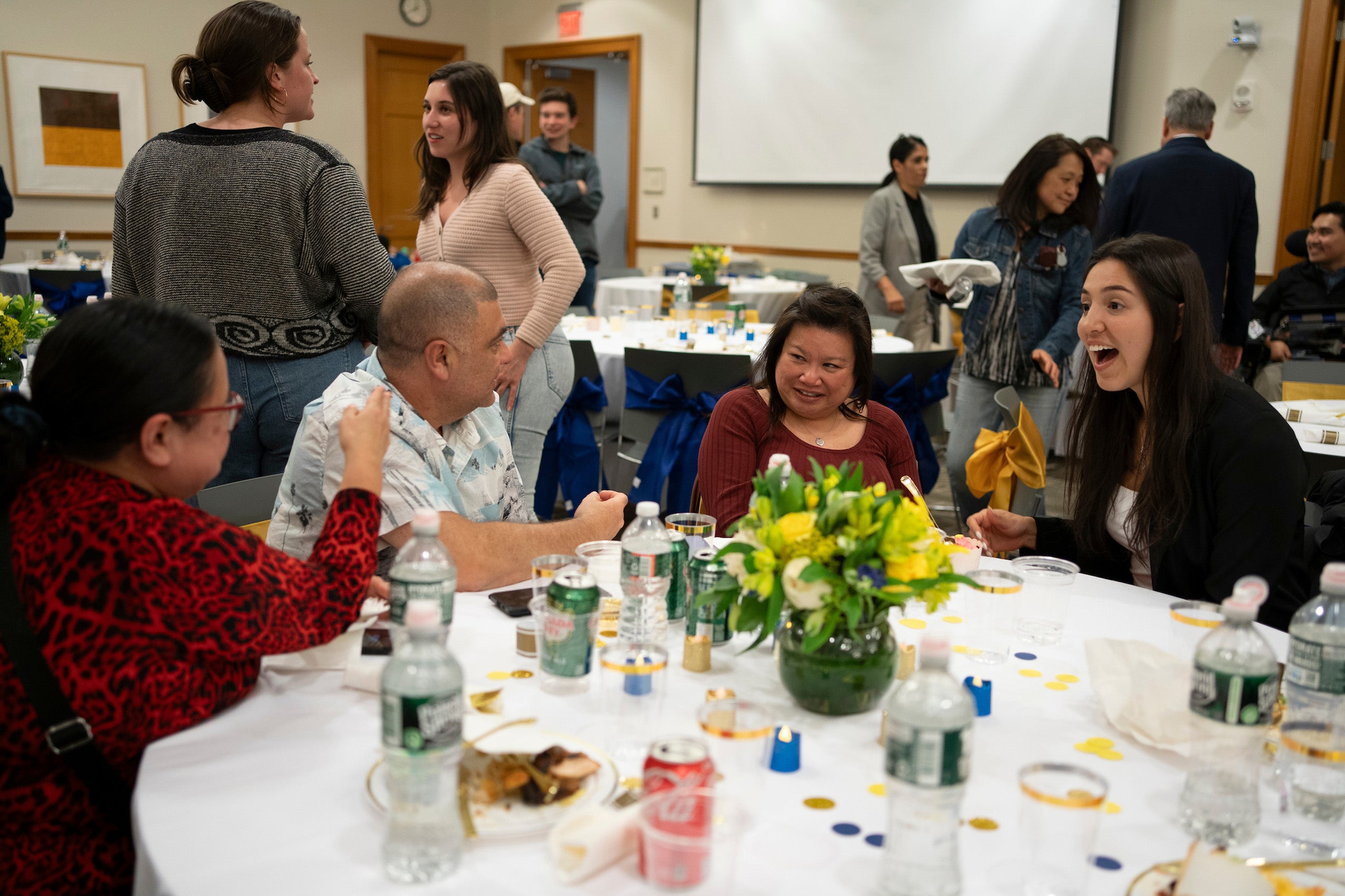 A table of people share a fun moment at an event