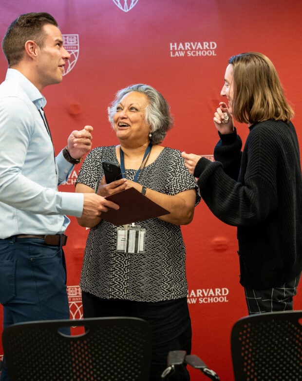 An award is presented to an individual on a stage.