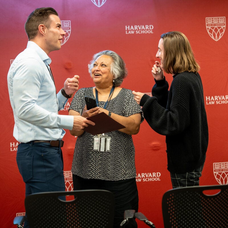 An award is presented to an individual on a stage.
