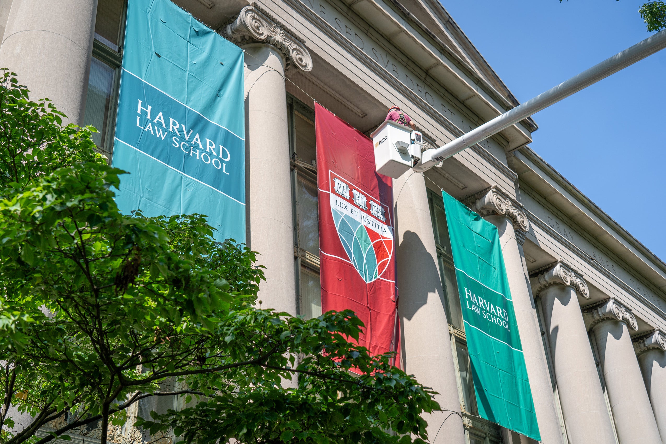 A view of the front of Langdell with HLS banners as they are being hung.