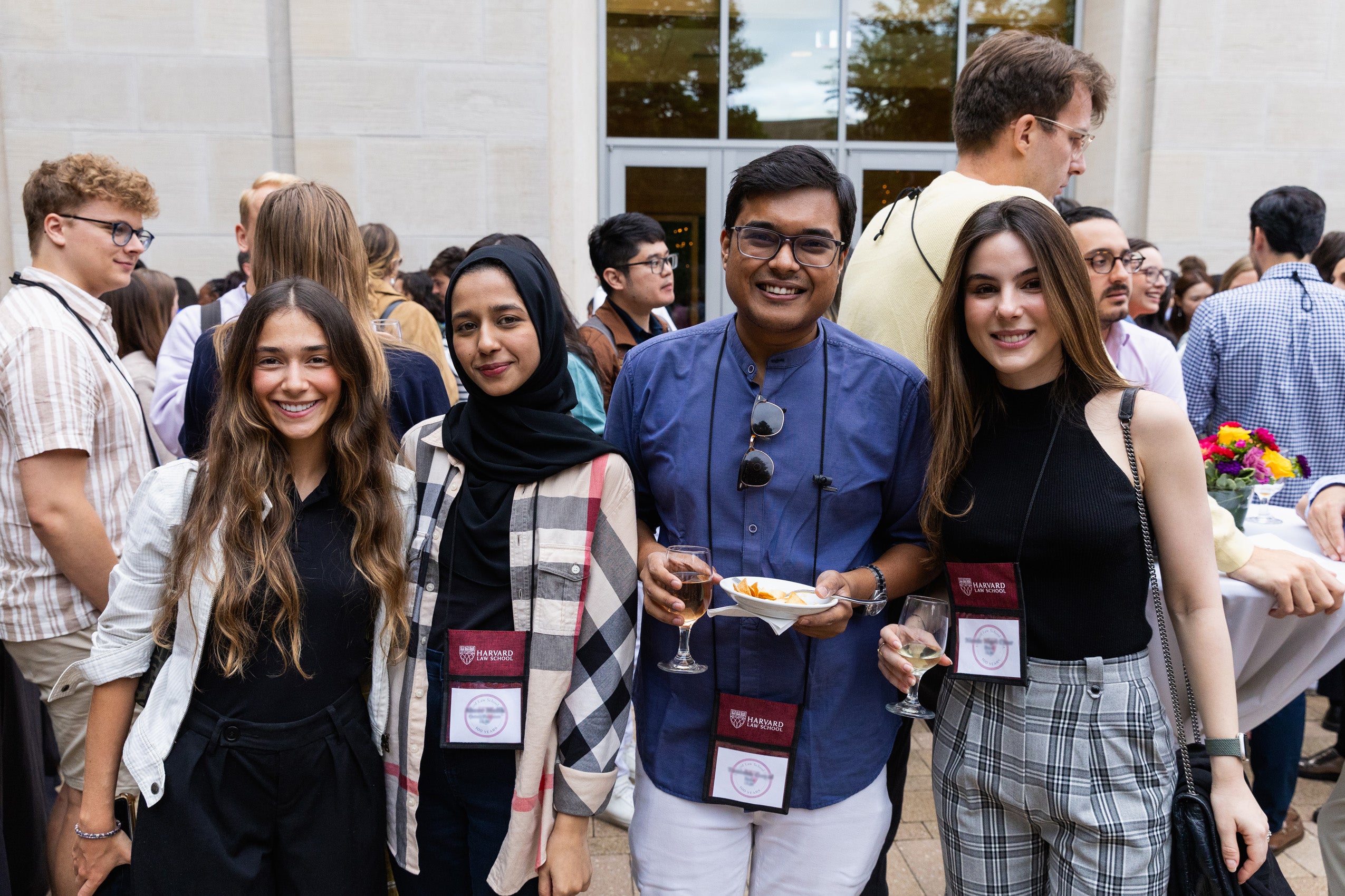 Four students pose for a photo at an orientation event.