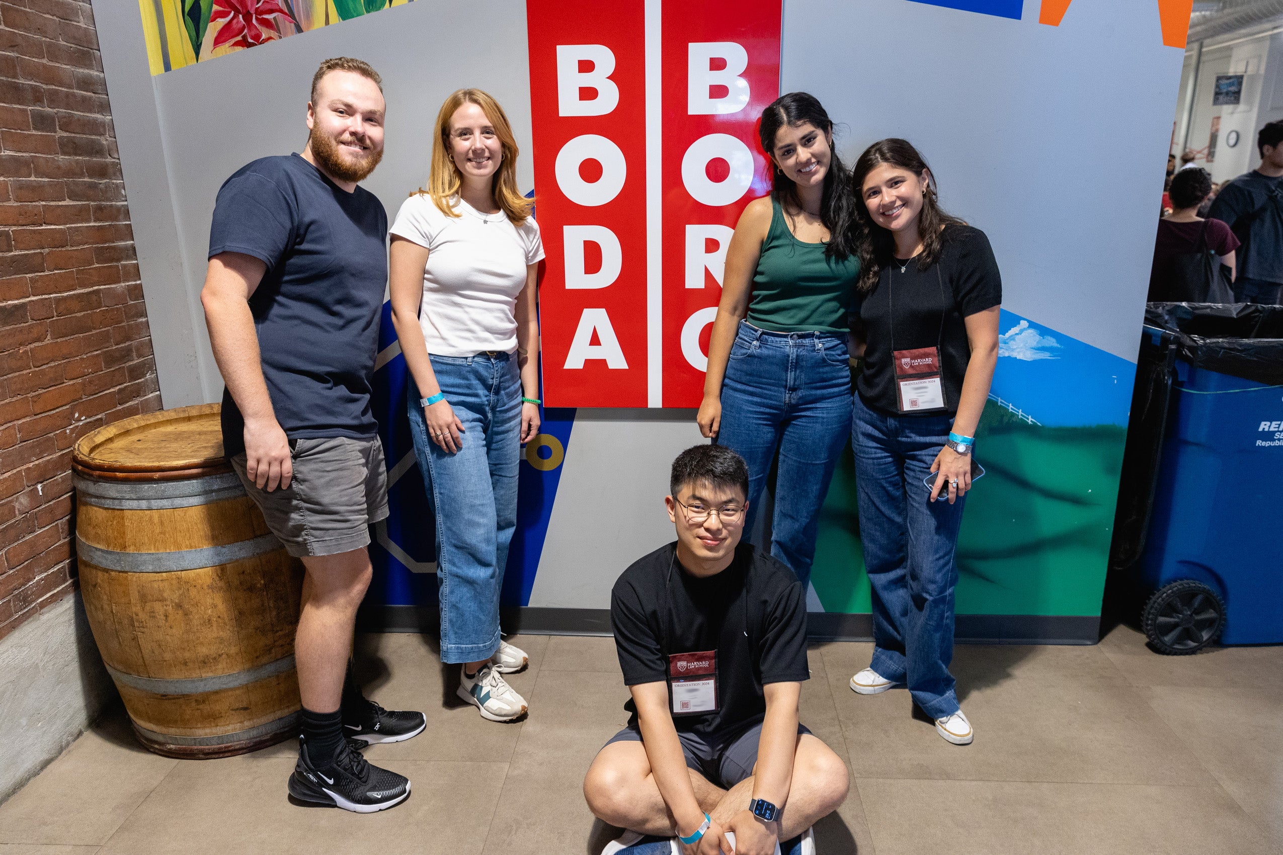 Students pose in front of the Boda Borg sign, an off campus game venue visited during orientation.