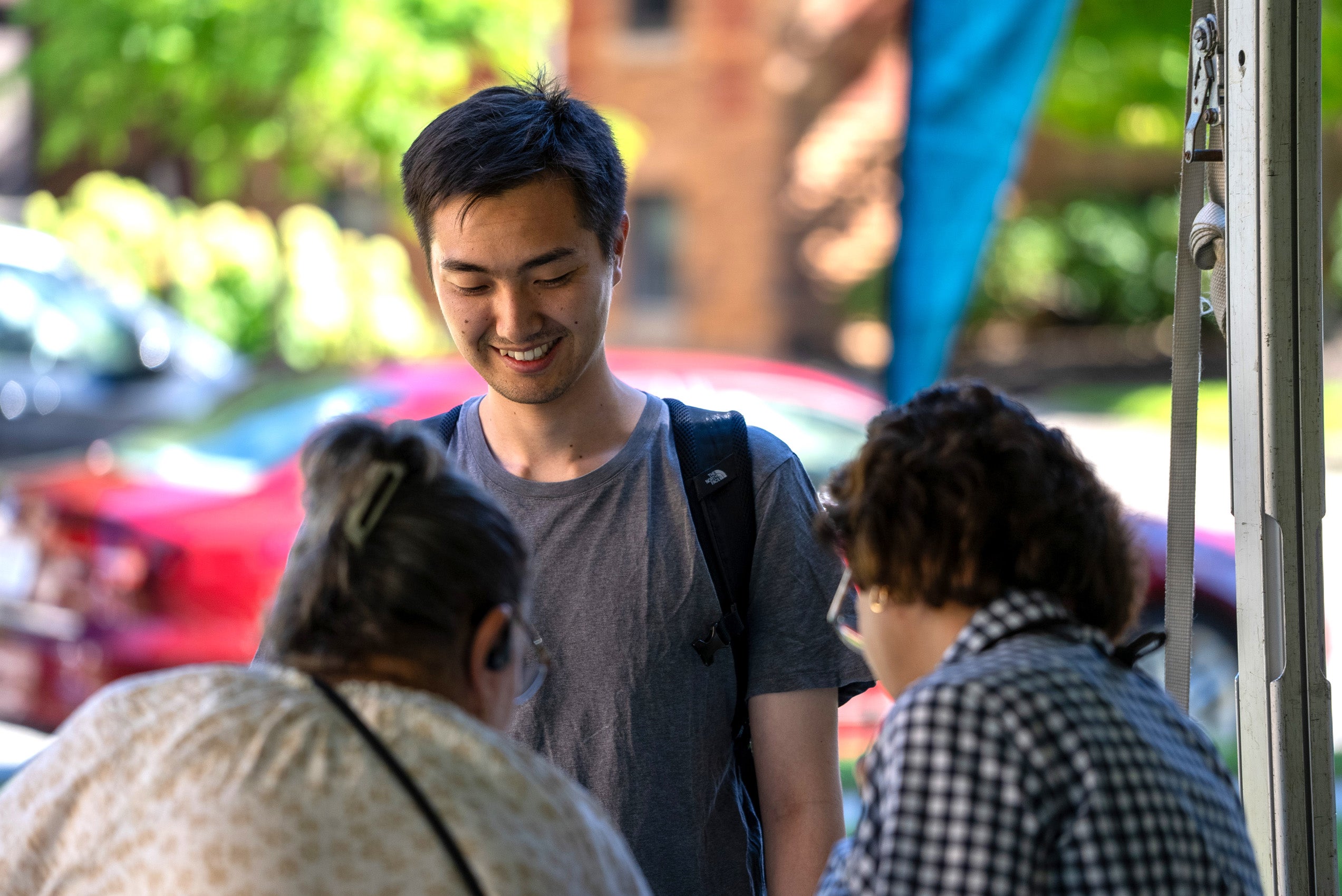Student smiling at check in table