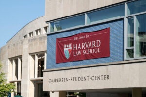 A banner on the Caspersen Student Center says Welcome to Harvard Law School