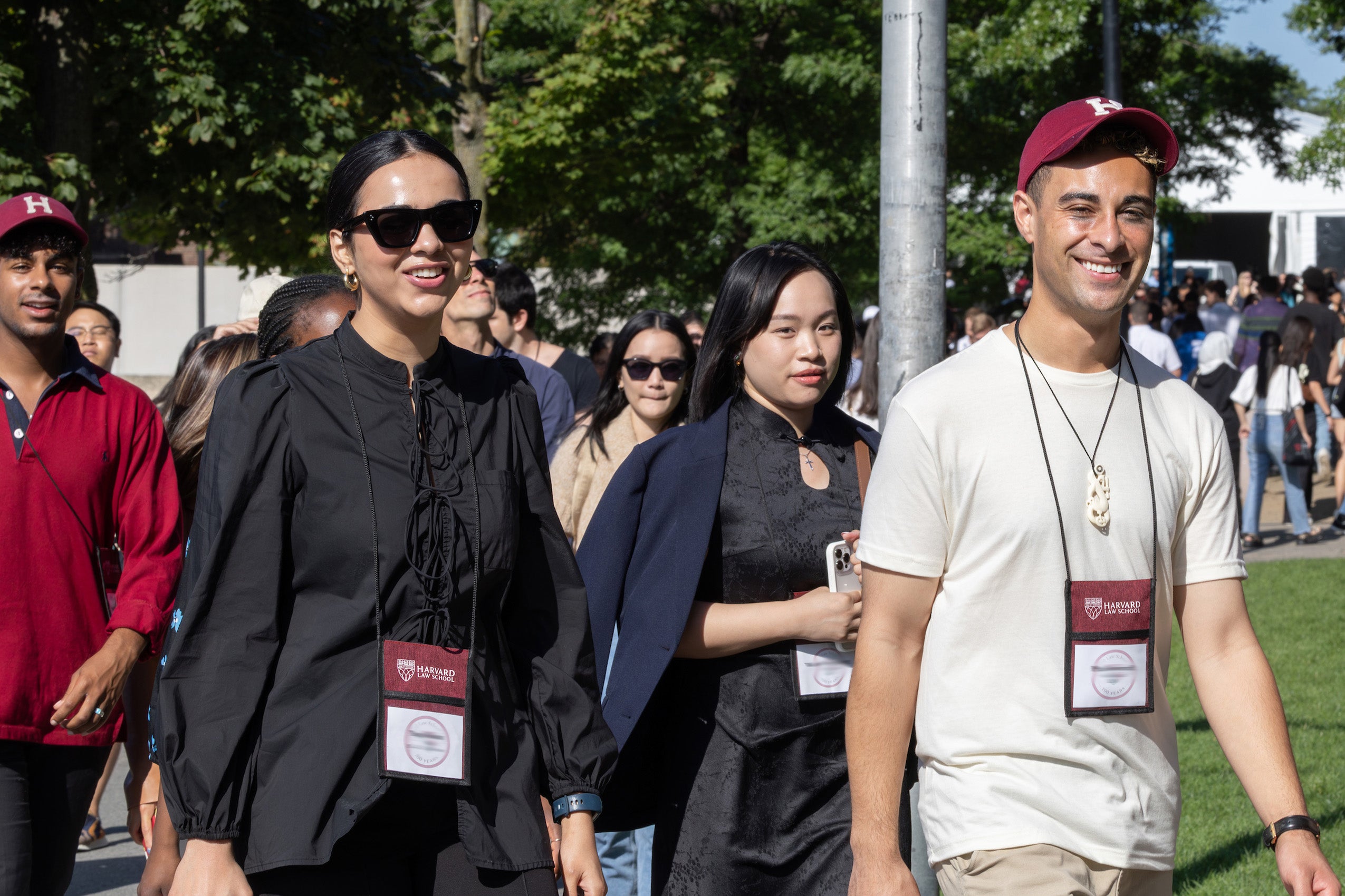 A group of students walking across campus during orientation.
