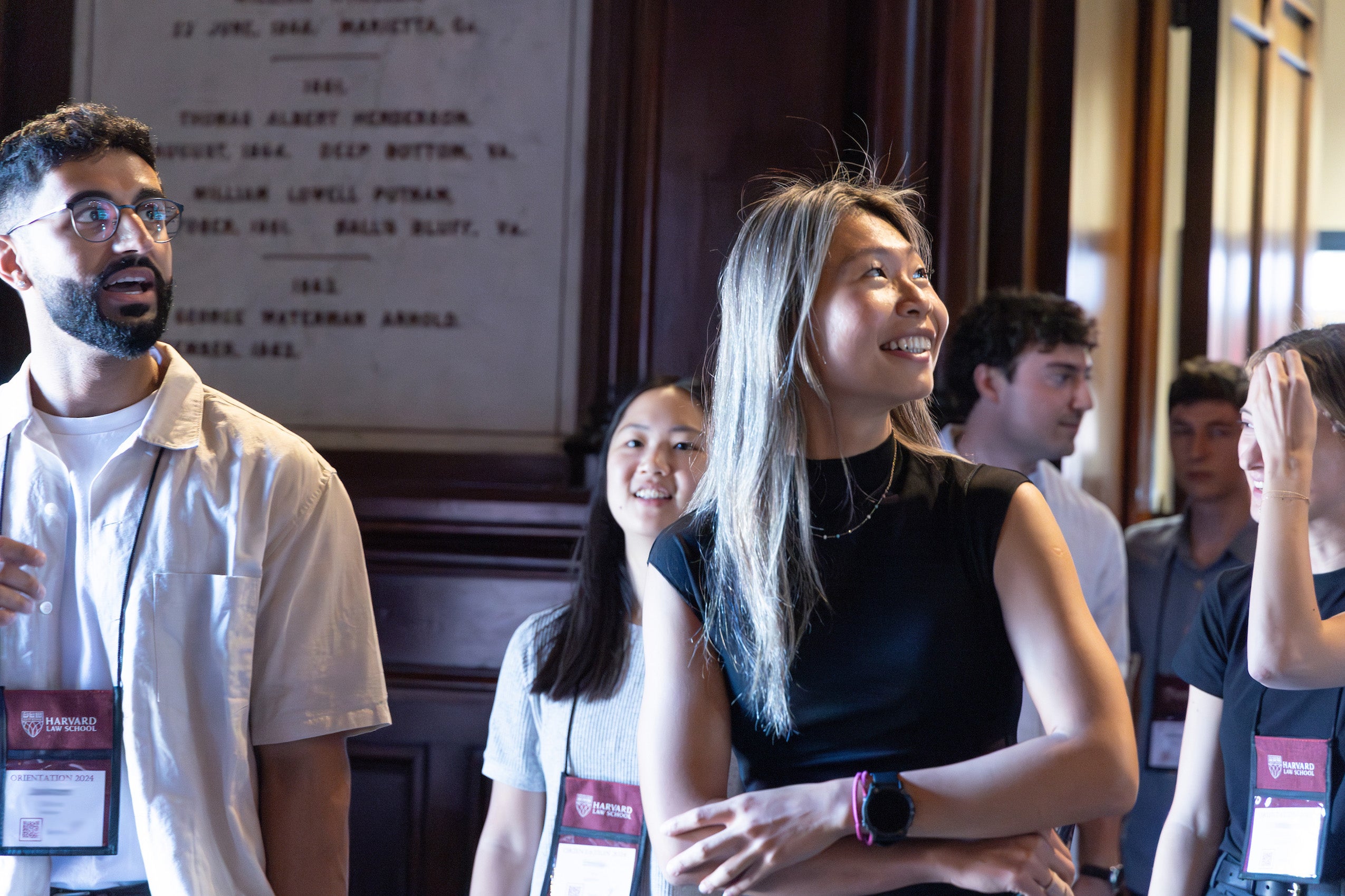A group of students entering a building during orientation.