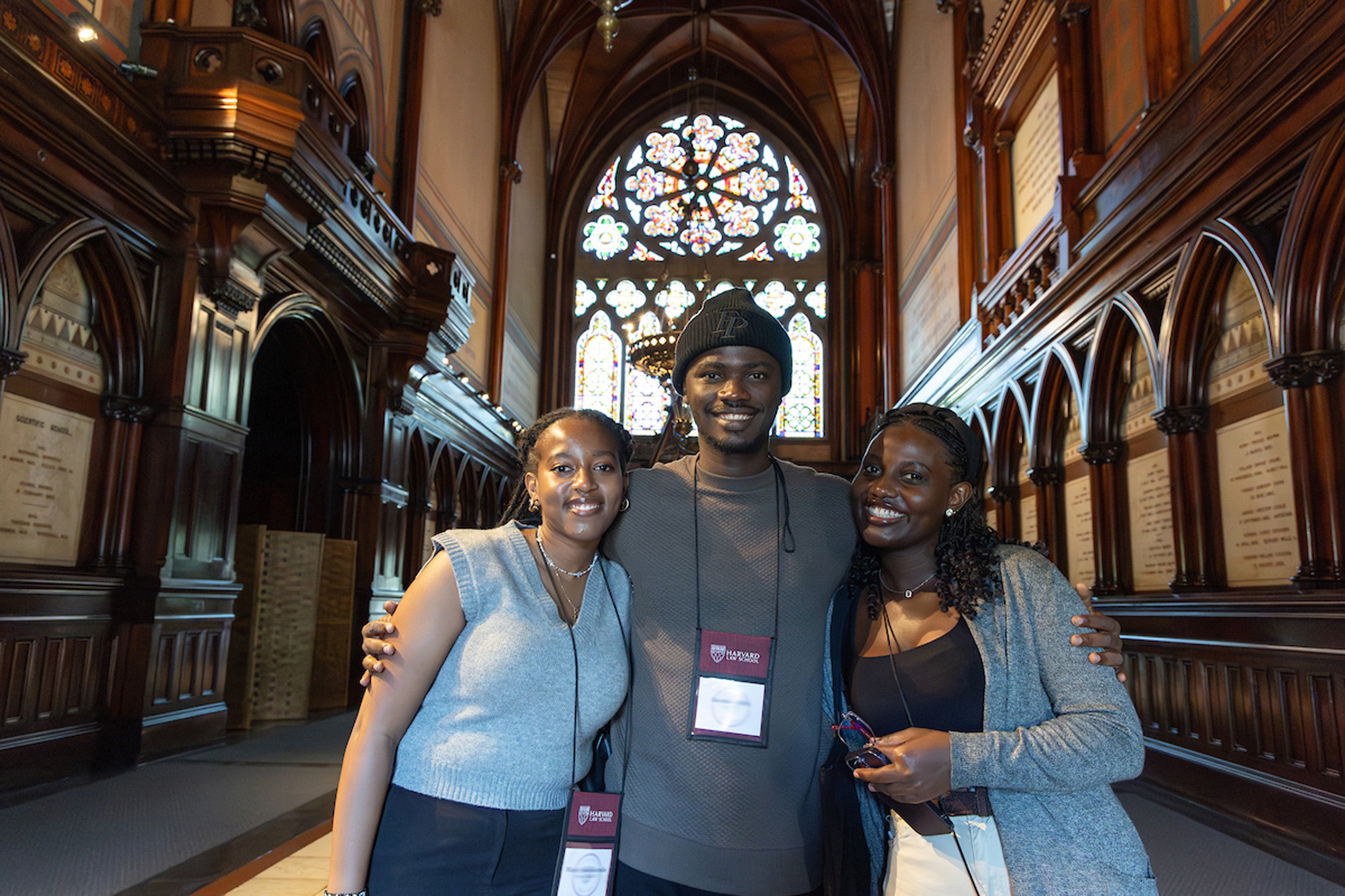 A group of students pose for a photos inside Sanders Theater during orientation.