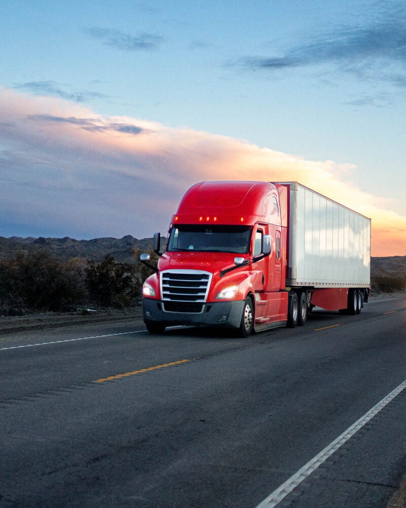 Red semi-trailer truck.