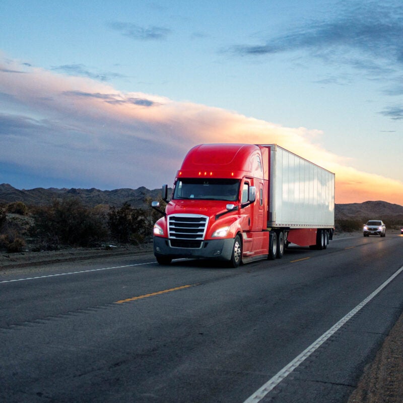 Red semi-trailer truck.