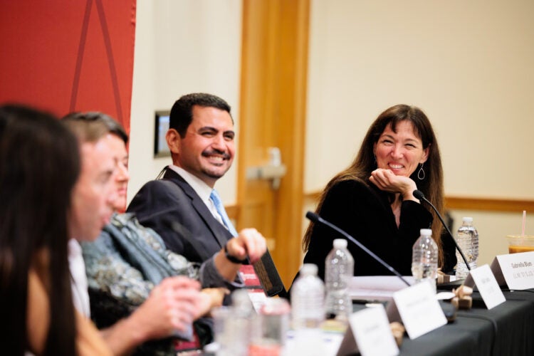 Panelists share a light moment