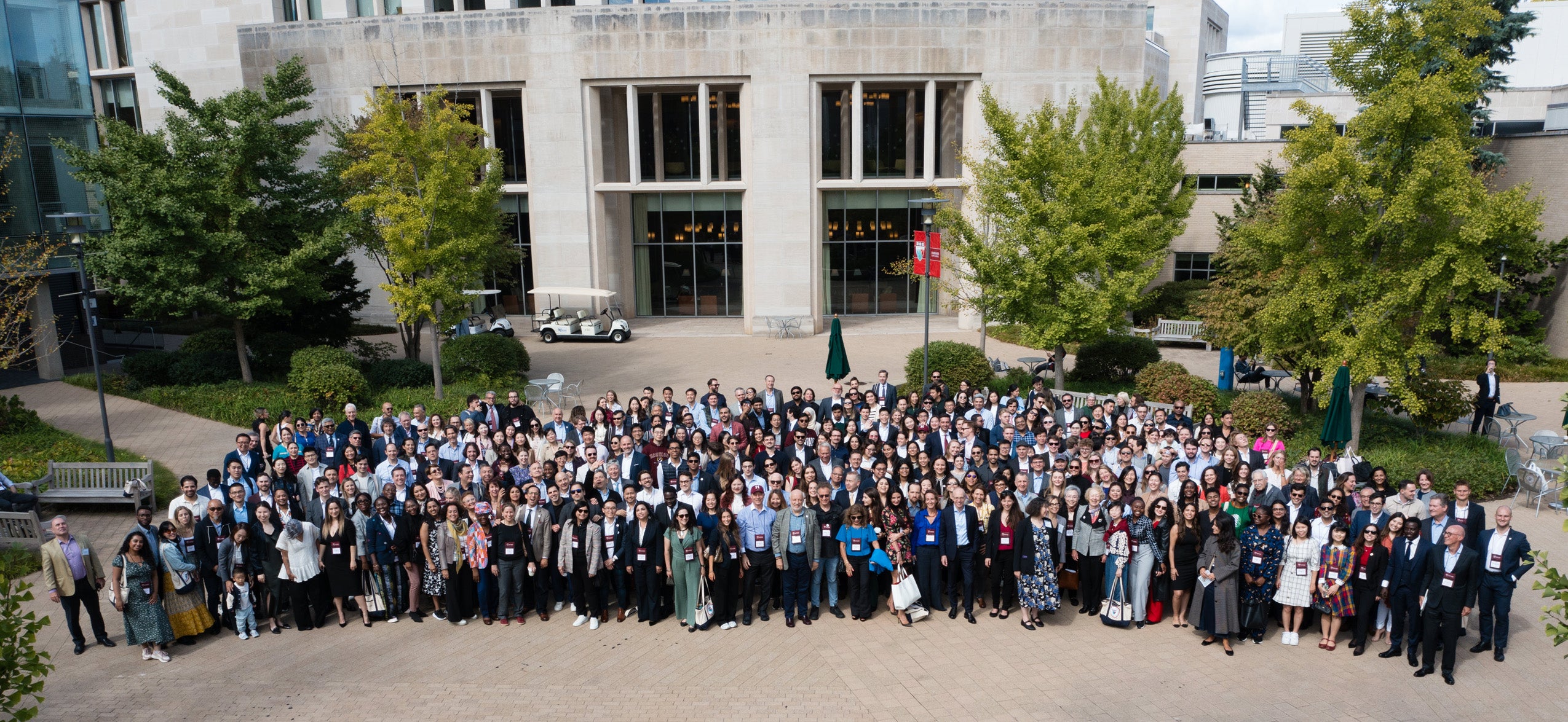 An aerial shot of a large group of people in a courtyard.
