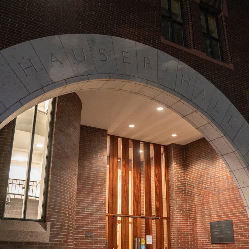 The entrance archway of a campus building in early evening.