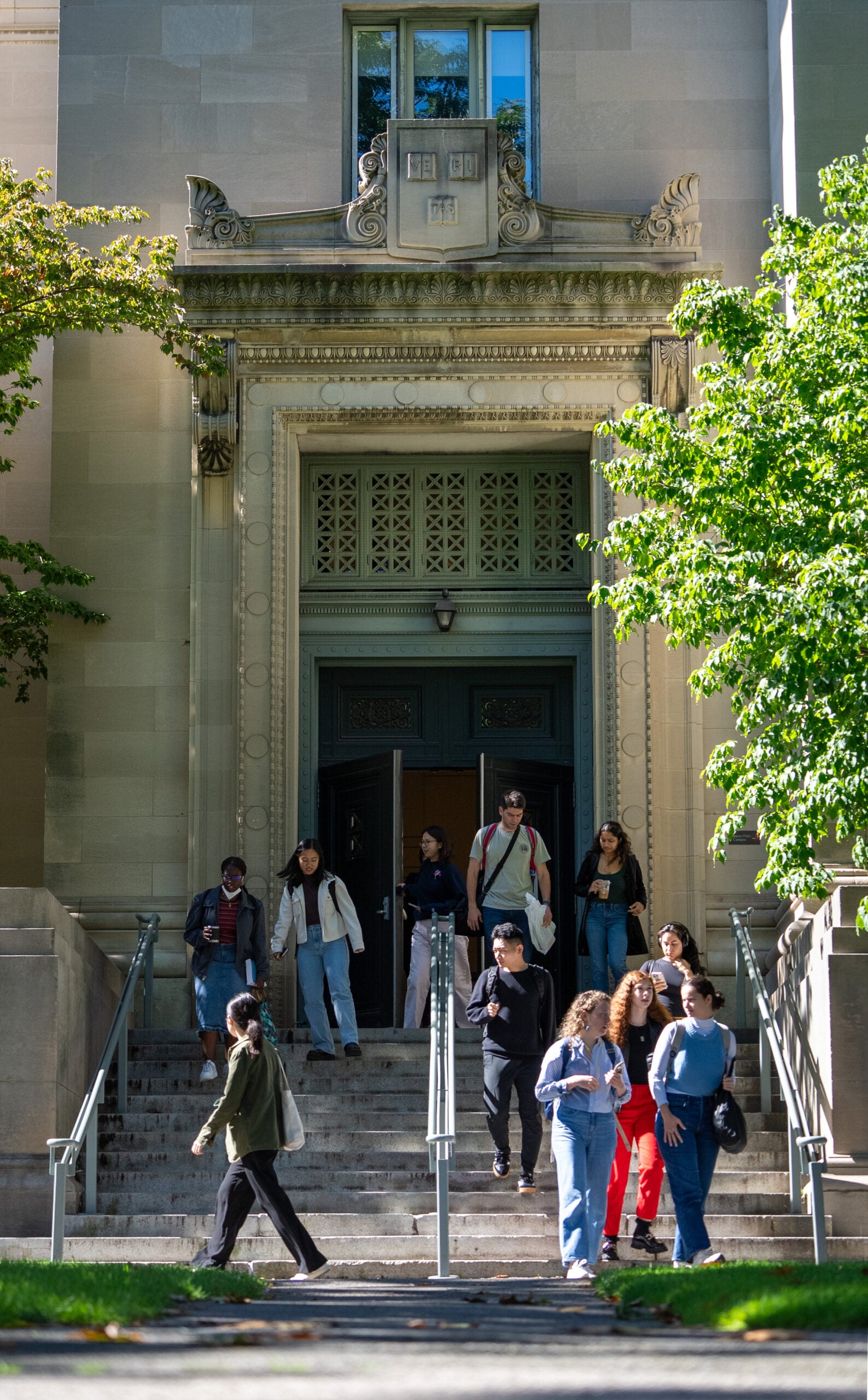 Students exiting a building through a doorway
