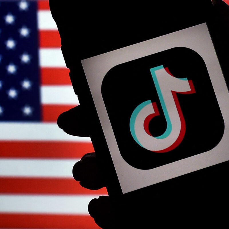 TikTok logo on American flag background.