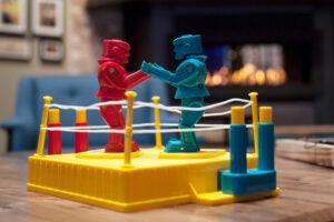 Toy robots fighting in a ring.