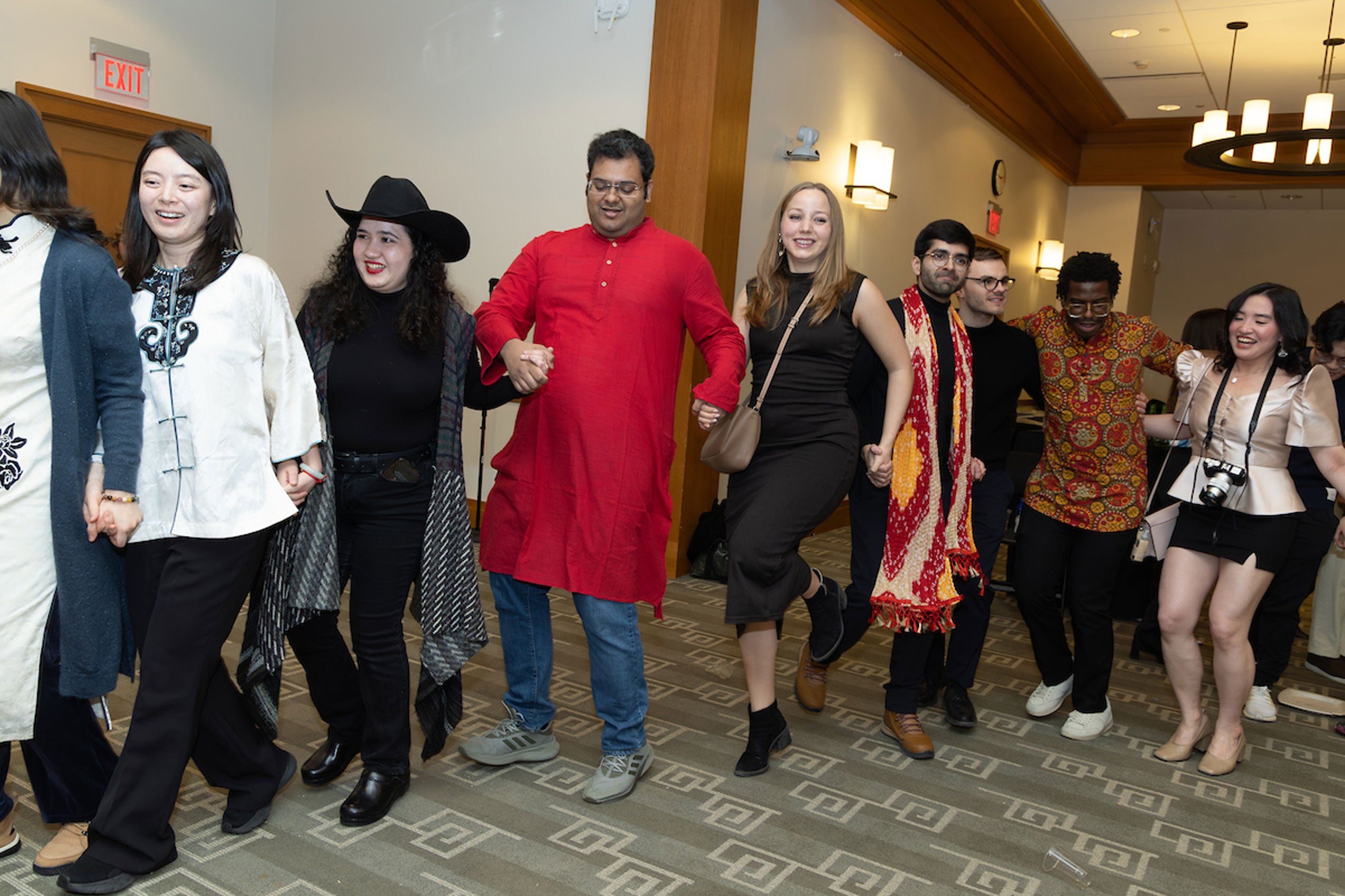 A group of students take part in a line dance at the international party.