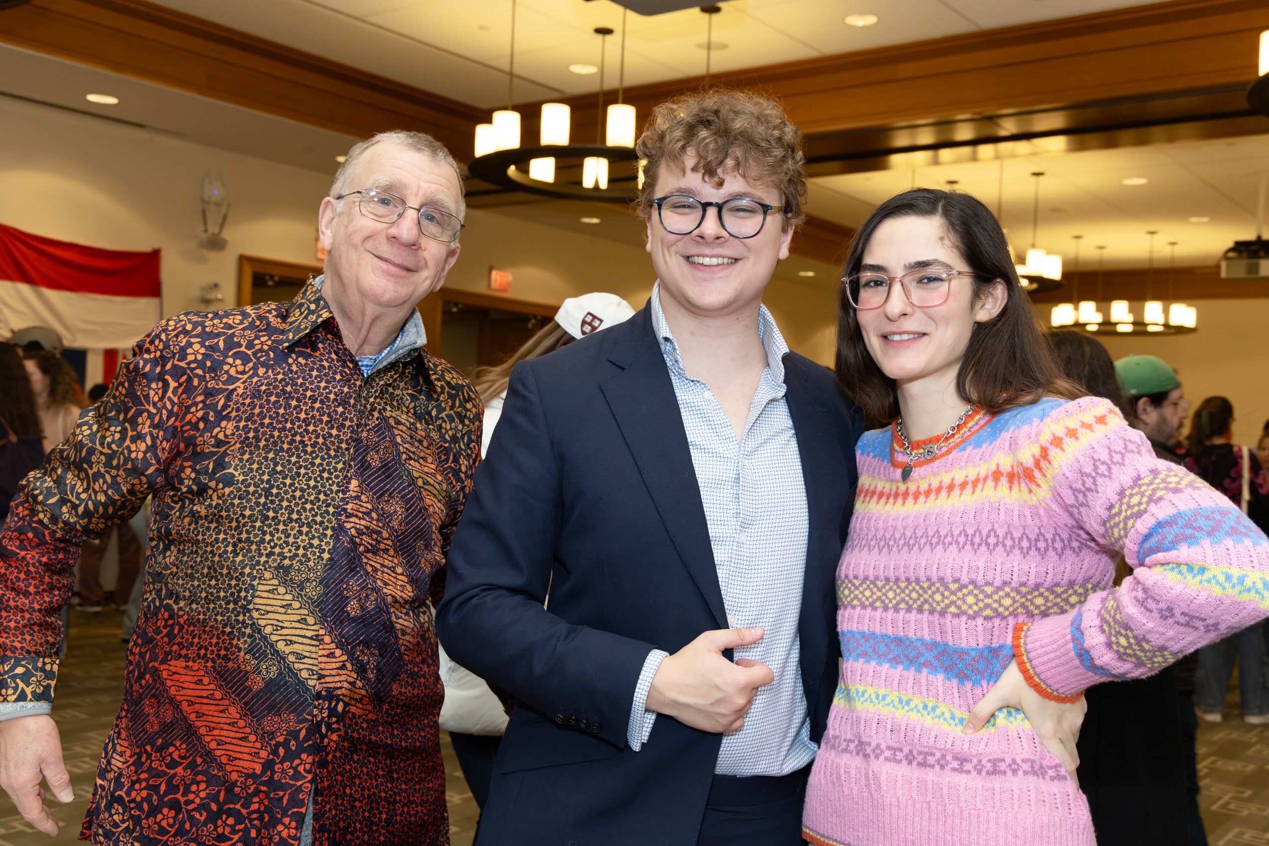 Professor Bill Alford and two students at an international event.