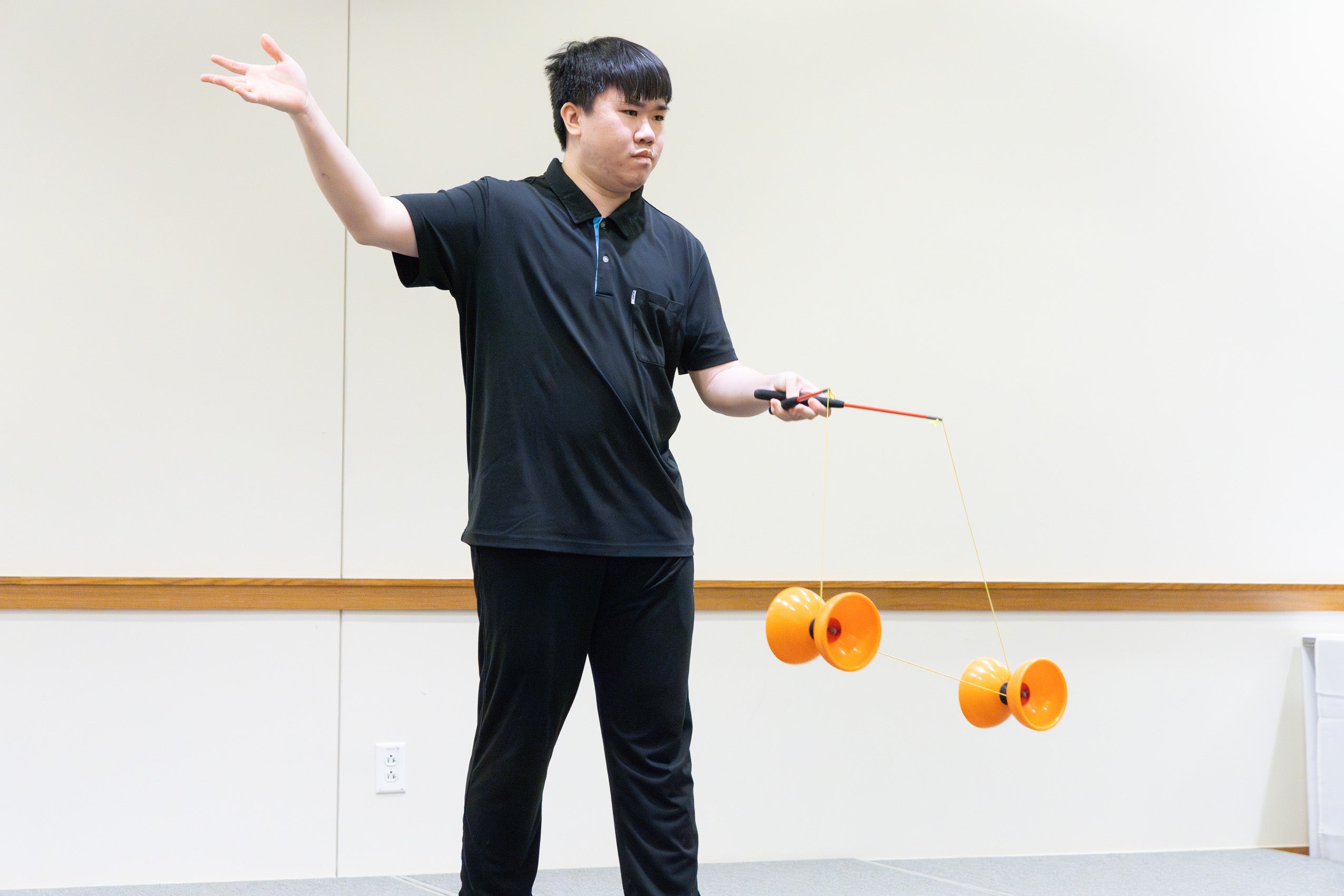 A man performs on stage at the international party.