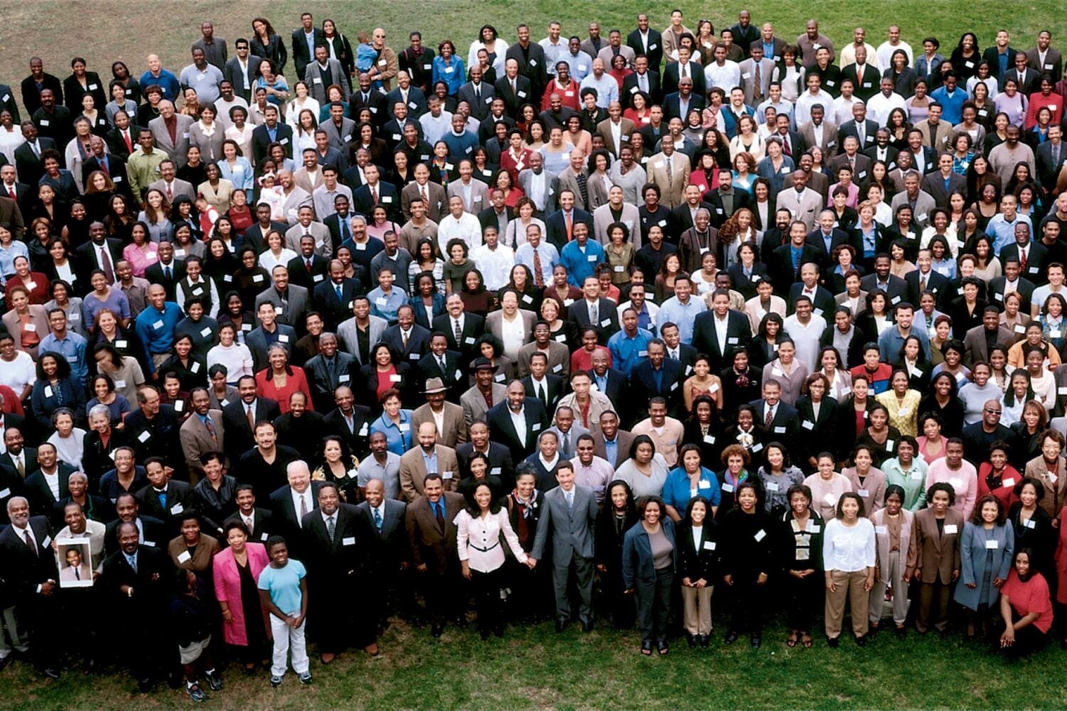 A large group gathers for a photo