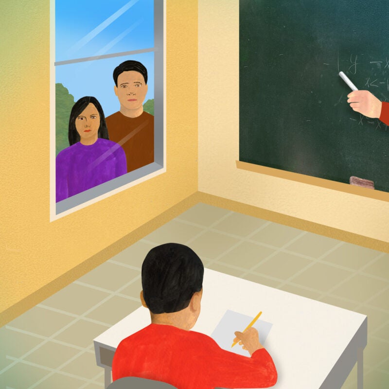 Illustration showing a classroom with parents looking through a window as a young boy is writing at his desk.