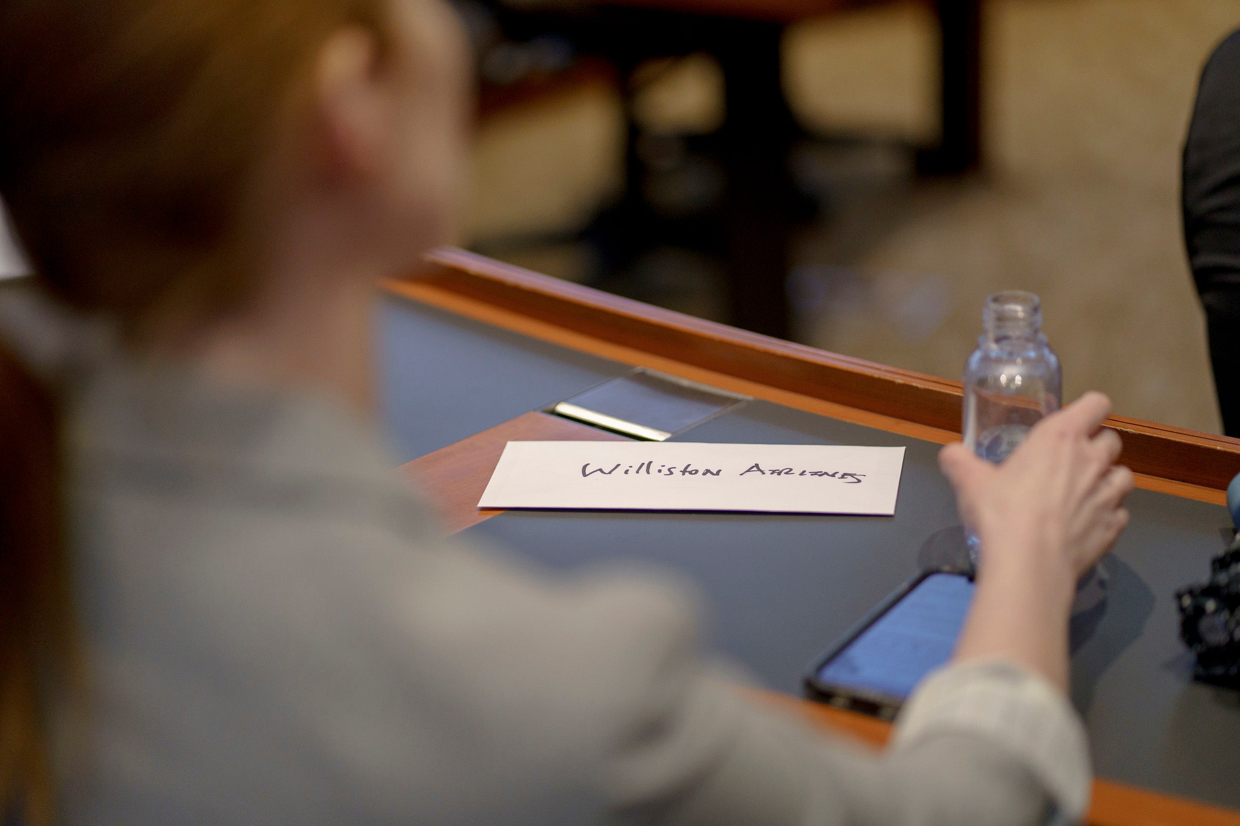 A look over the shoulders of someone at a desk.