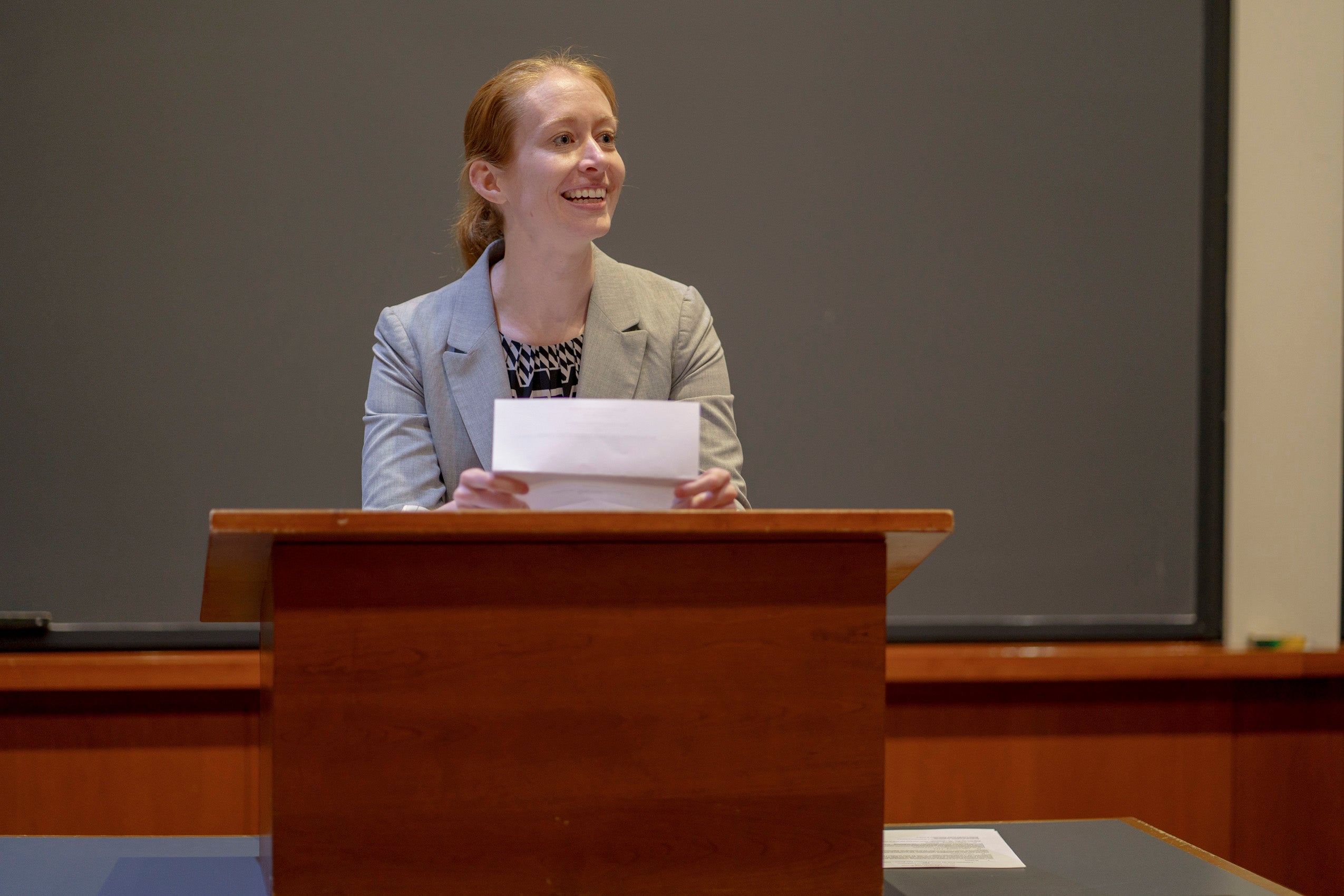 A person makes an announcement from a podim