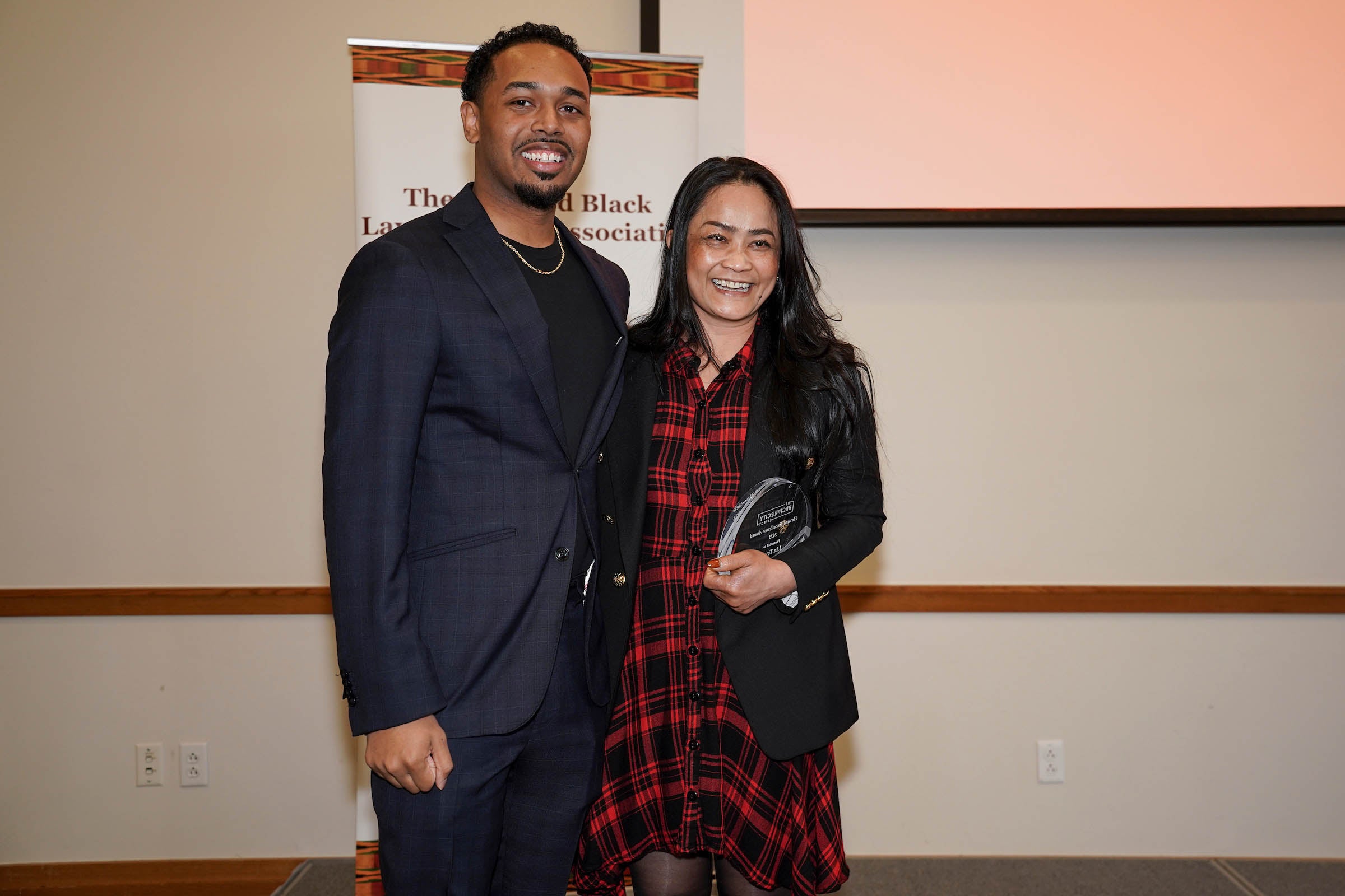 Rehan Staton poses with an awardee.