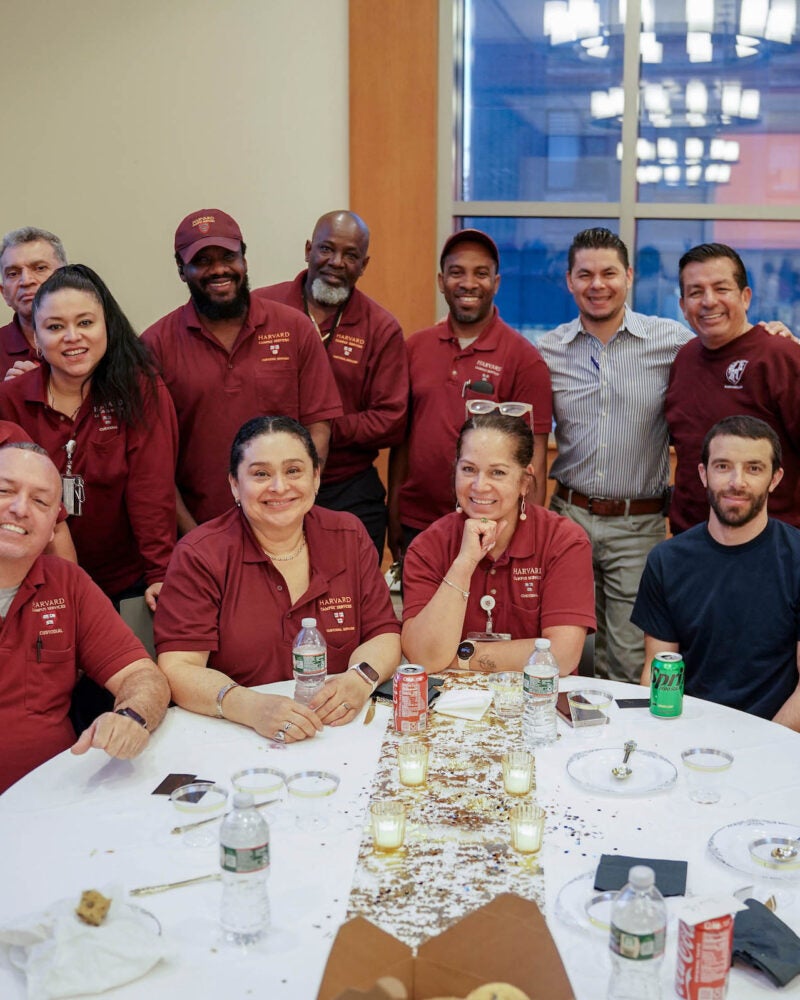 Members of custodial services gather for a photo.