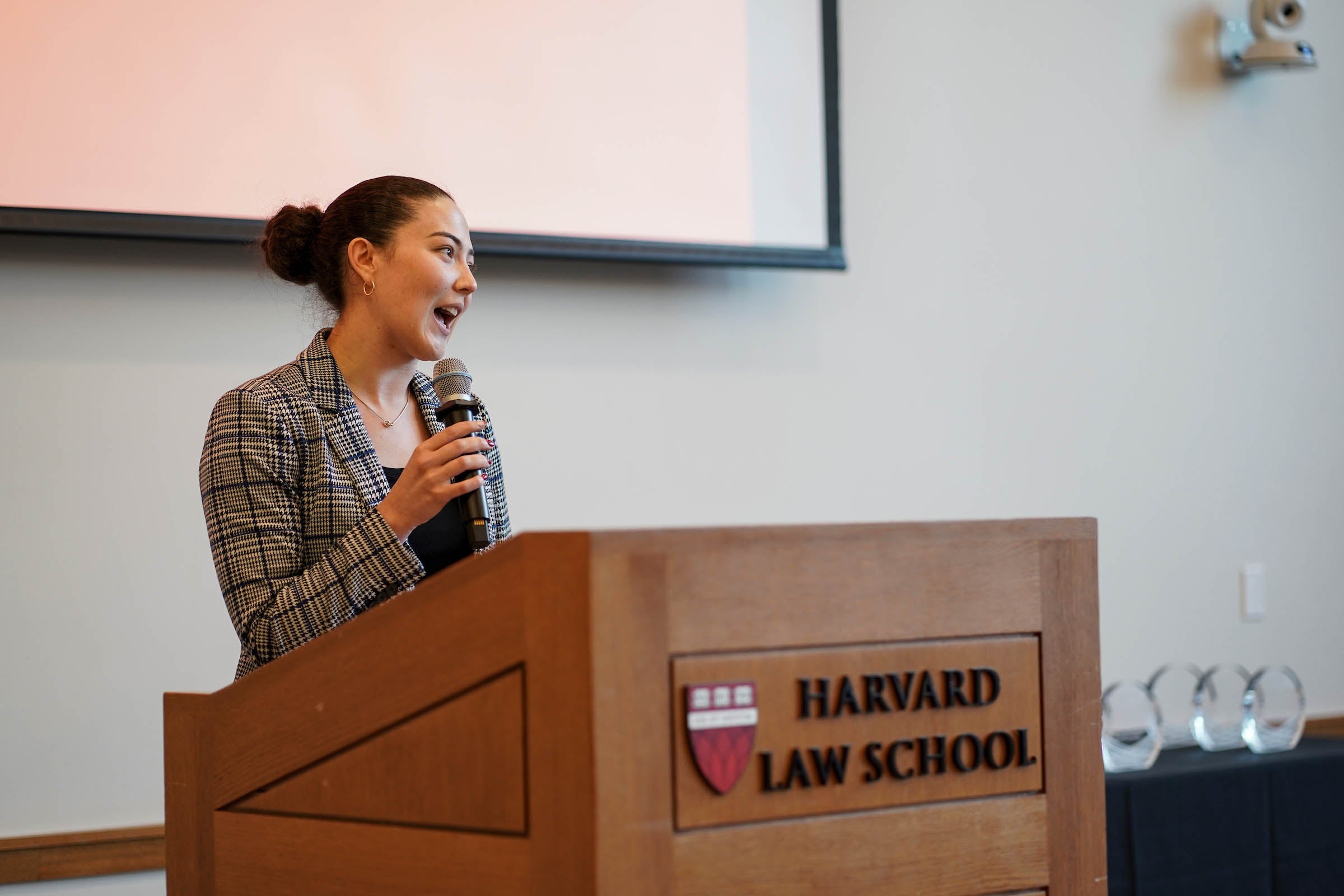 A student delivers remarks to the audience.