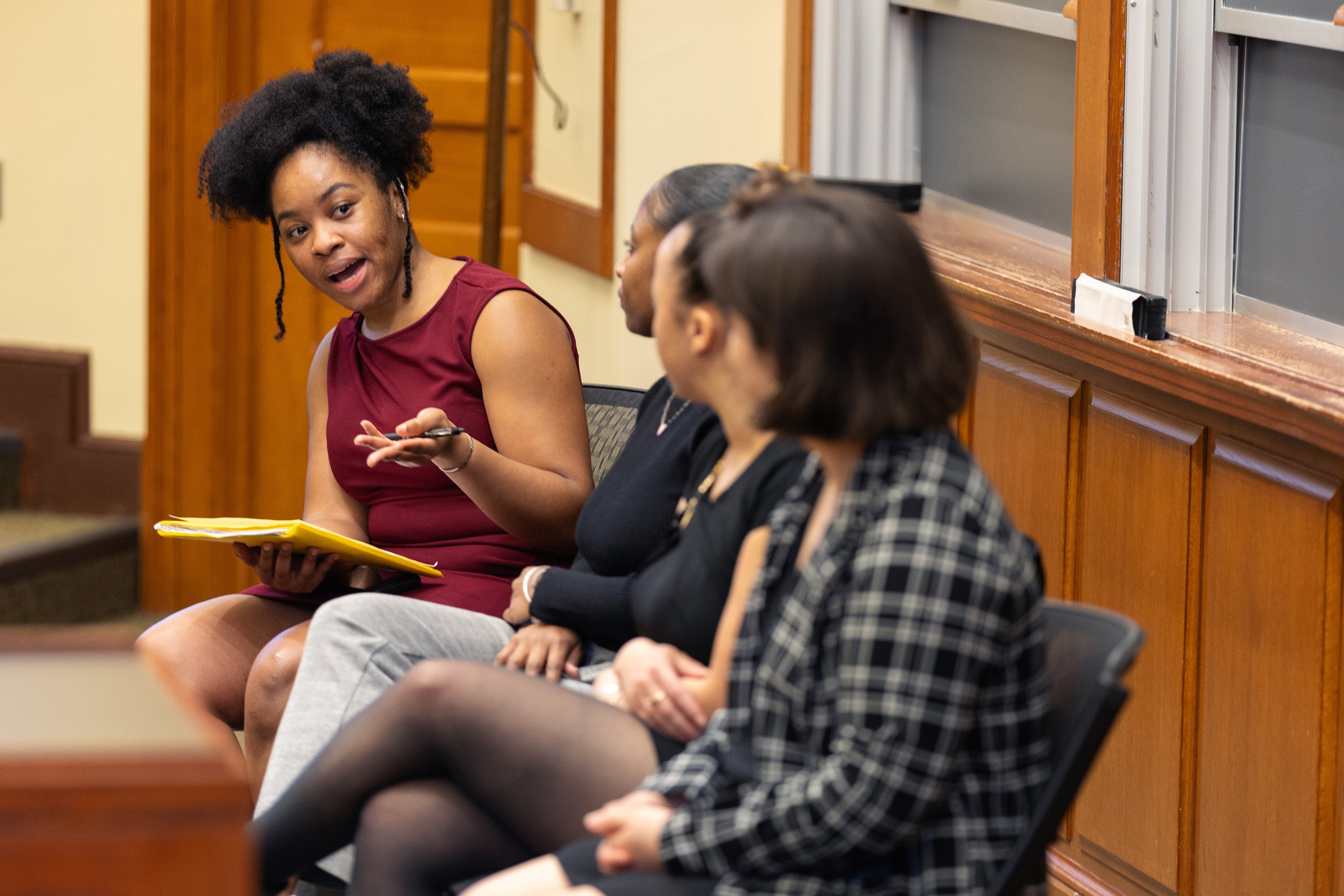A women speaks on a panel.