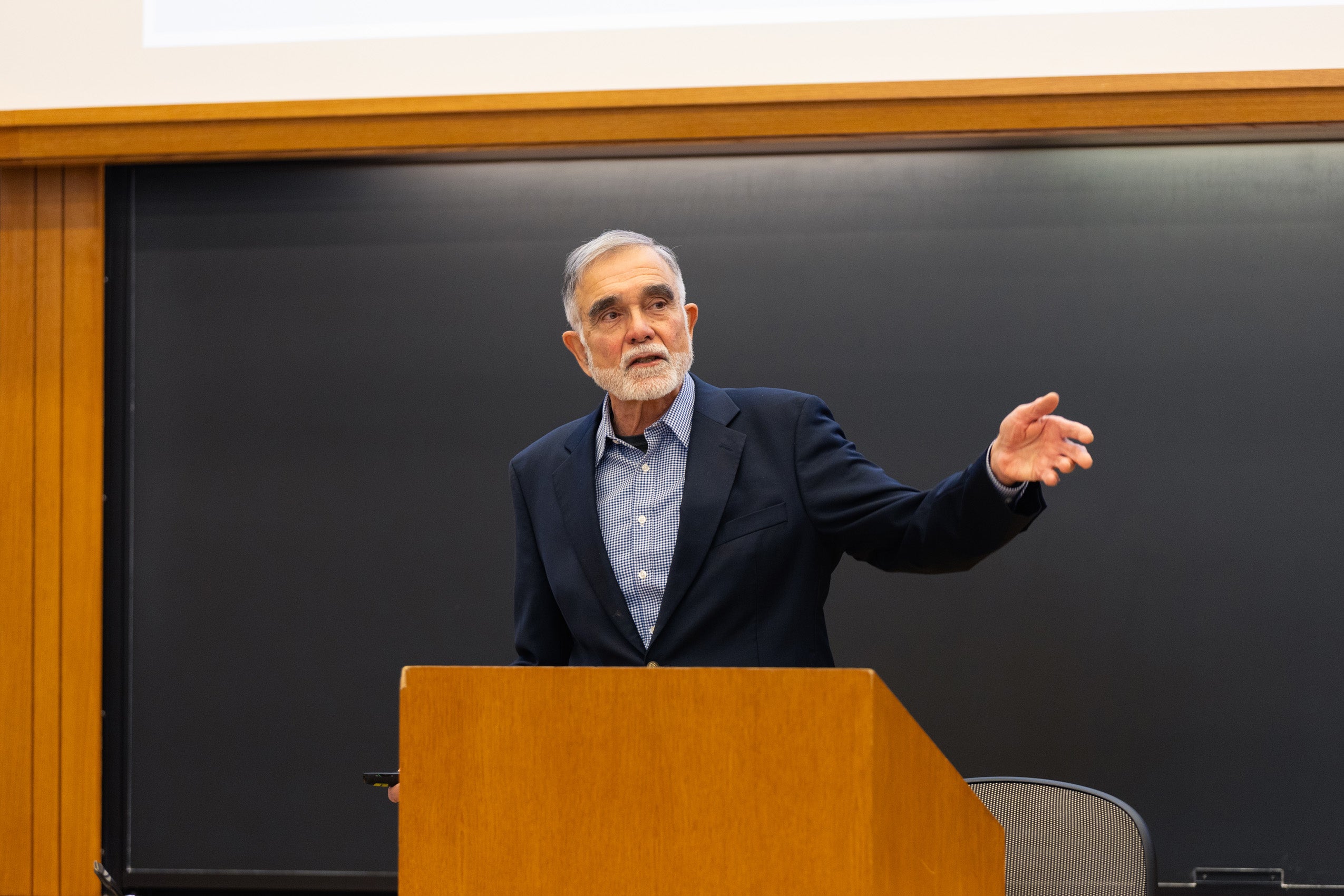 John Leshy at a podium.