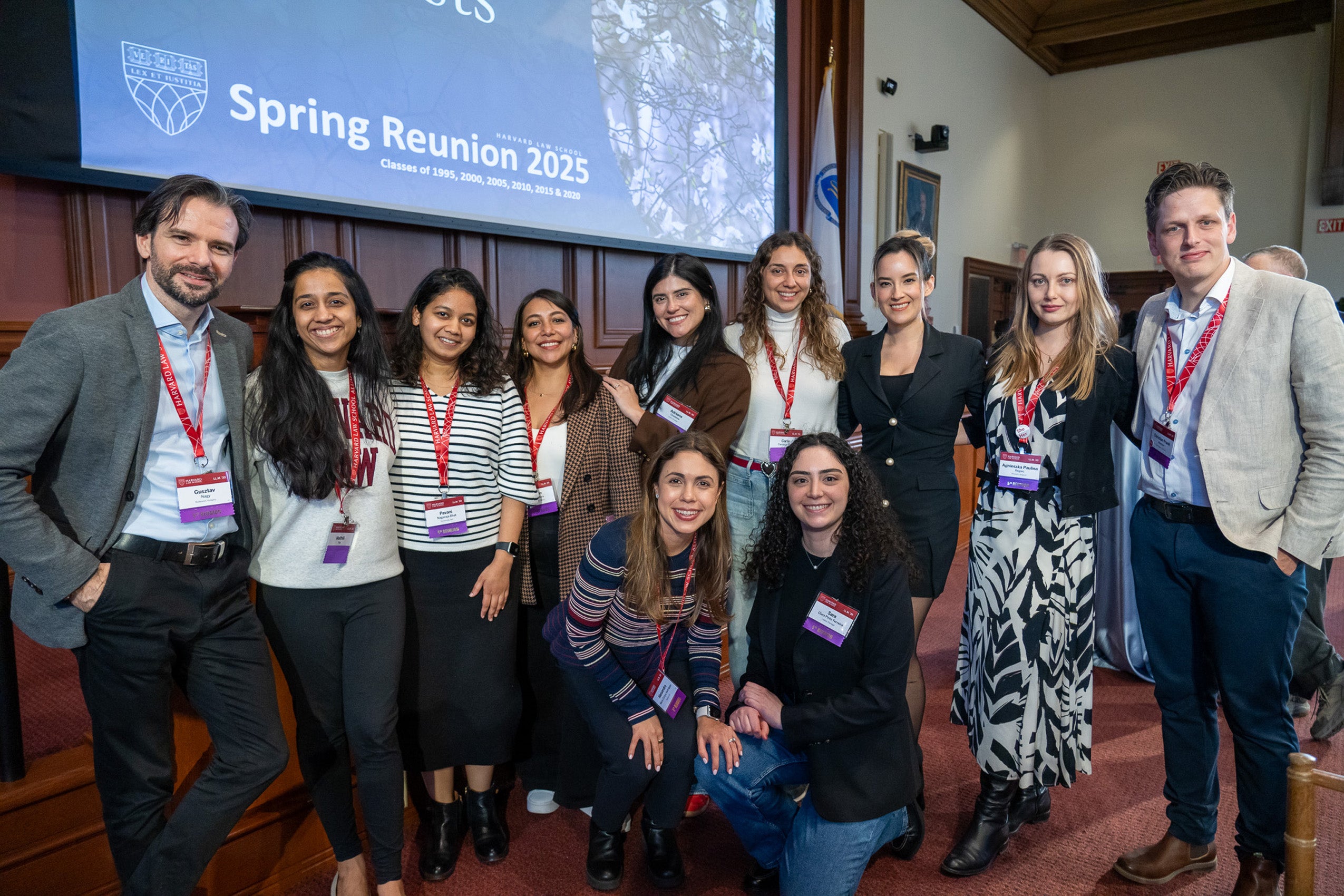 A group pose for a photo at a reunion event.