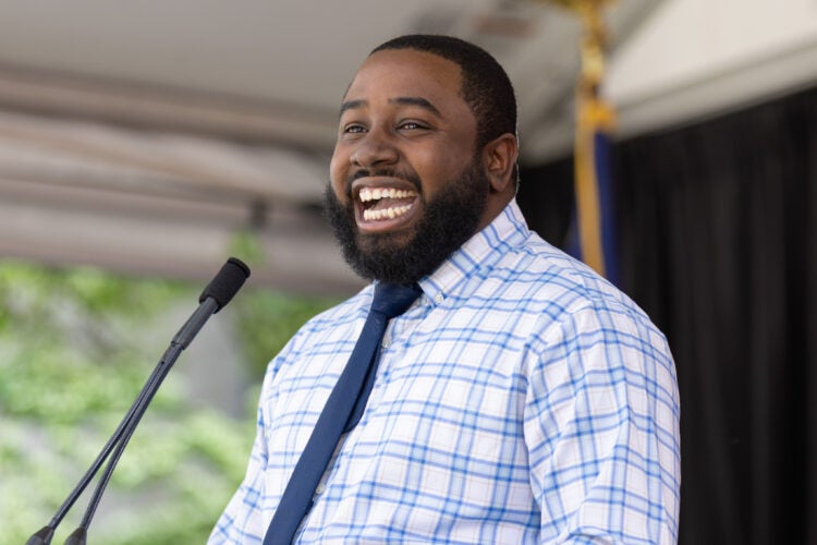 A man standing and speaking at a podium