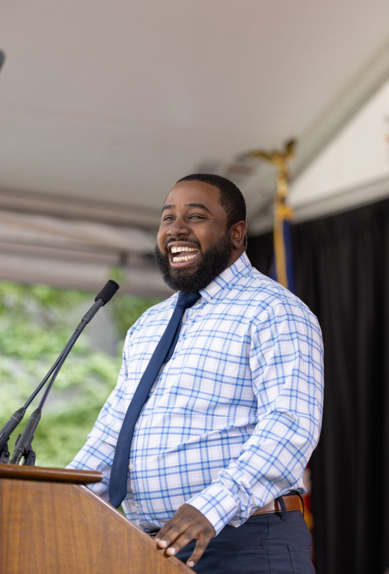 A man standing and speaking at a podium