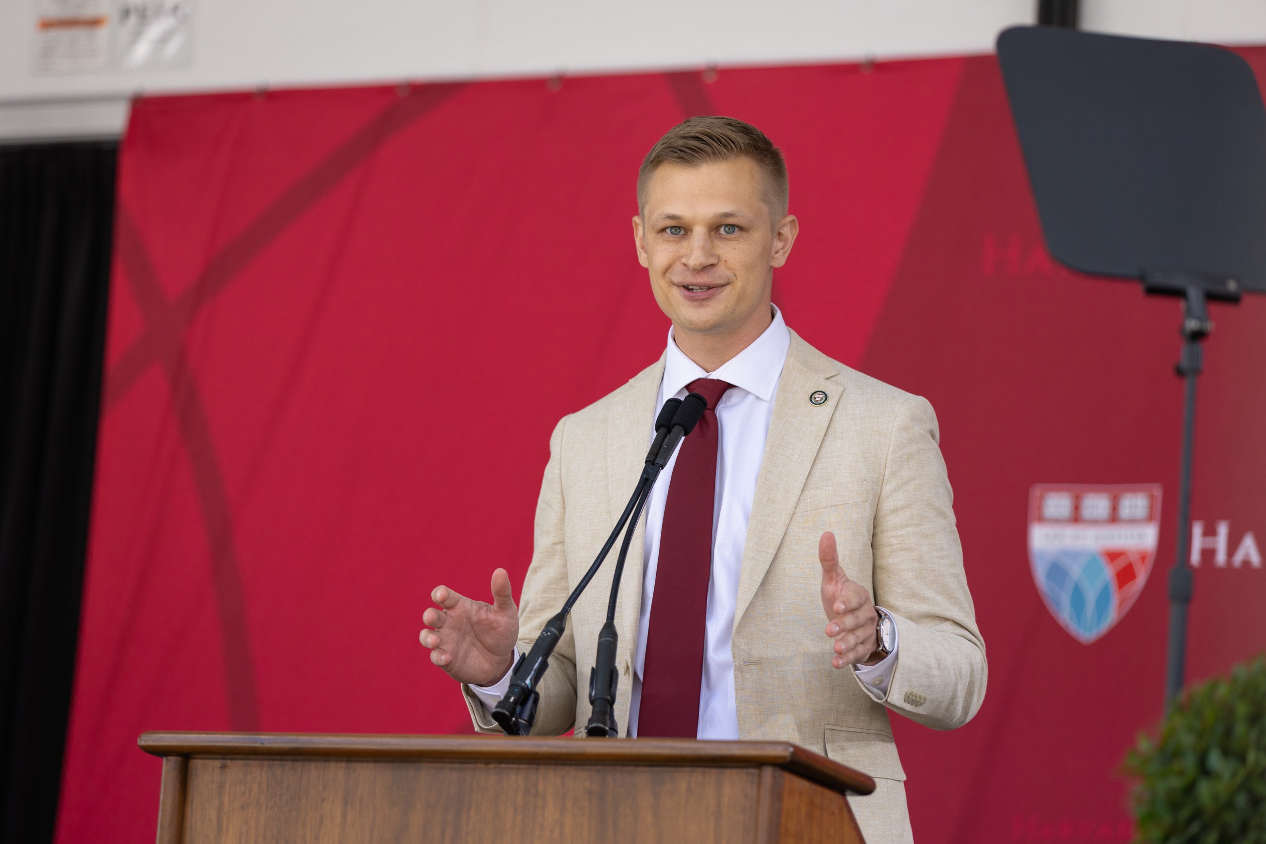 A man standing and speaking at a podium