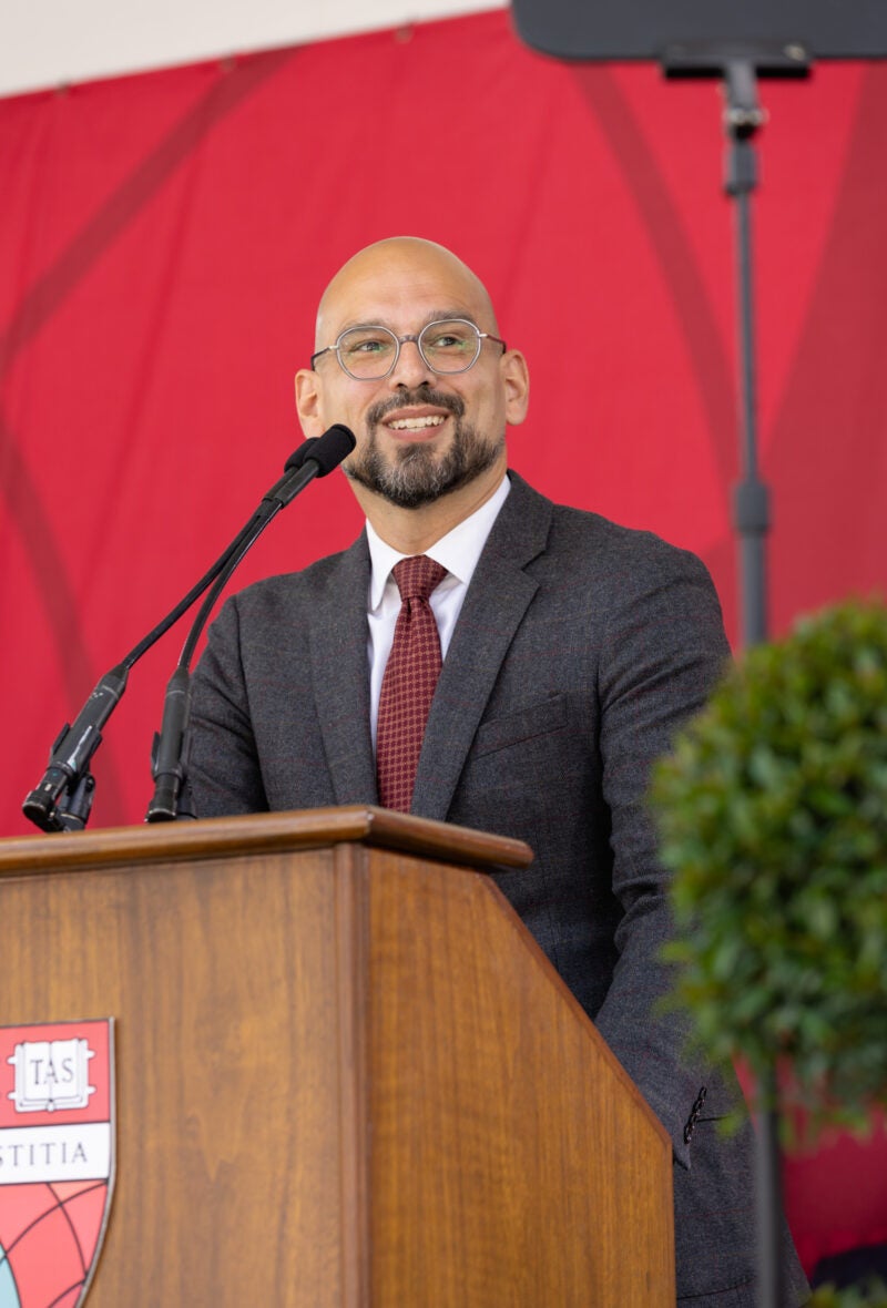 A man standing and speaking at a podium